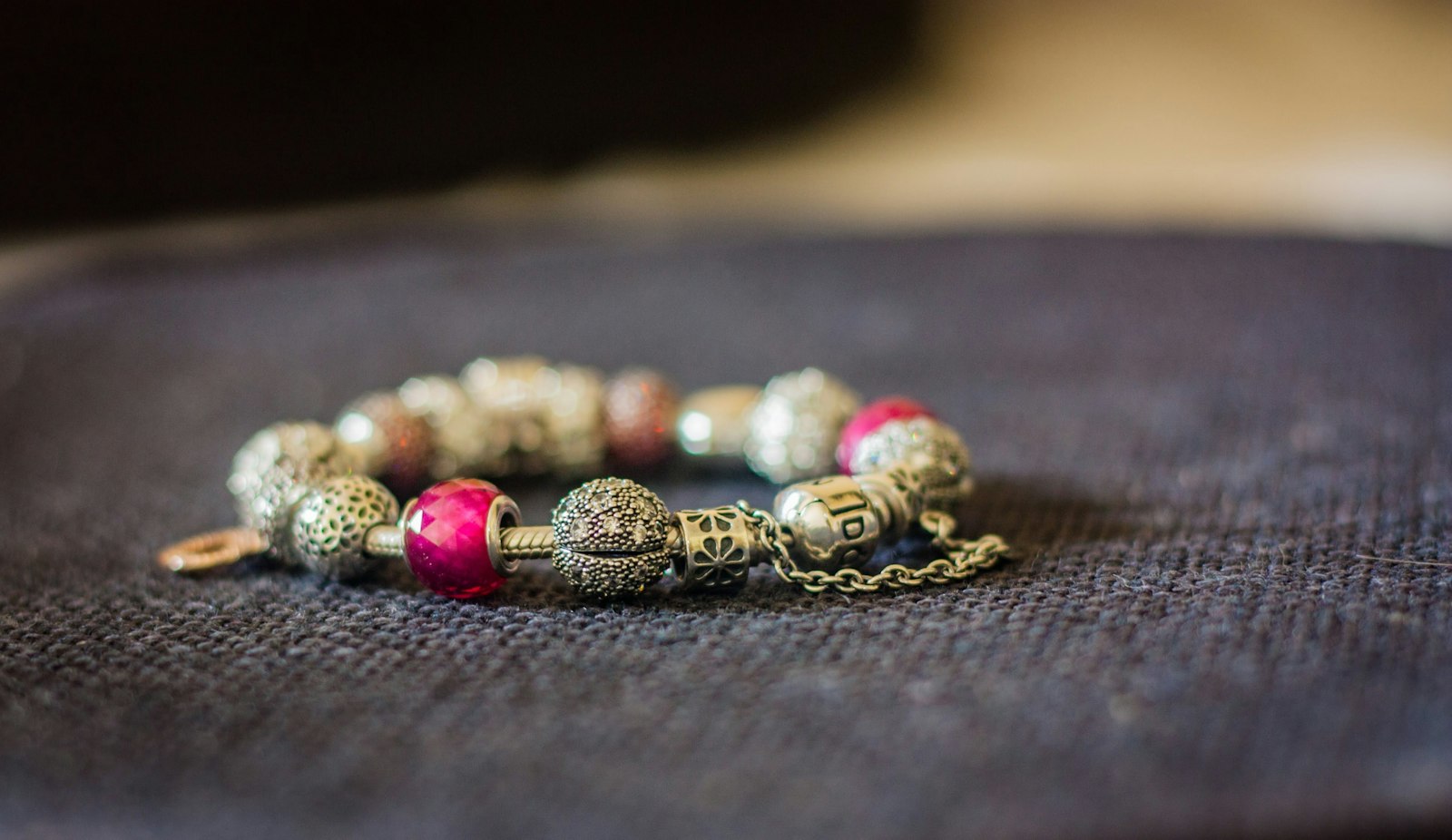 Colorful beaded bracelet on a dark surface