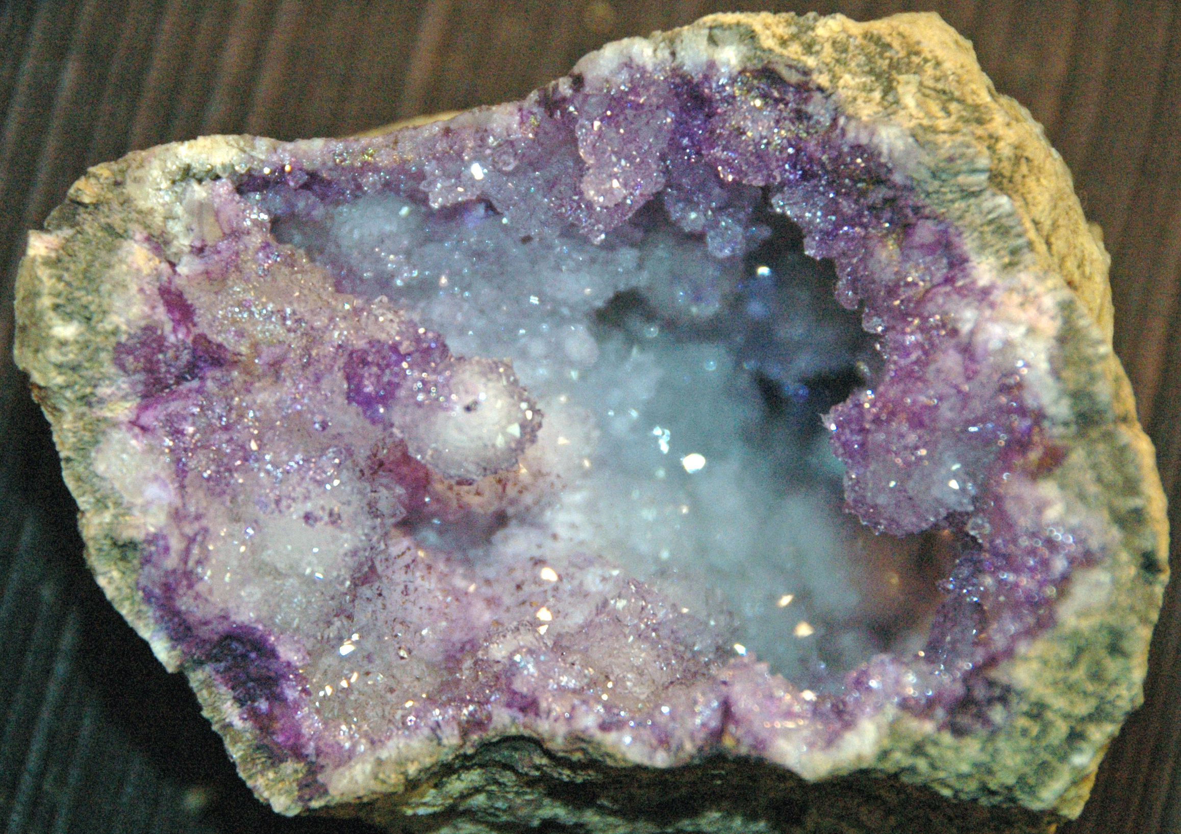 Open geode with sparkling purple and white crystals, the inspiration for resin geode art