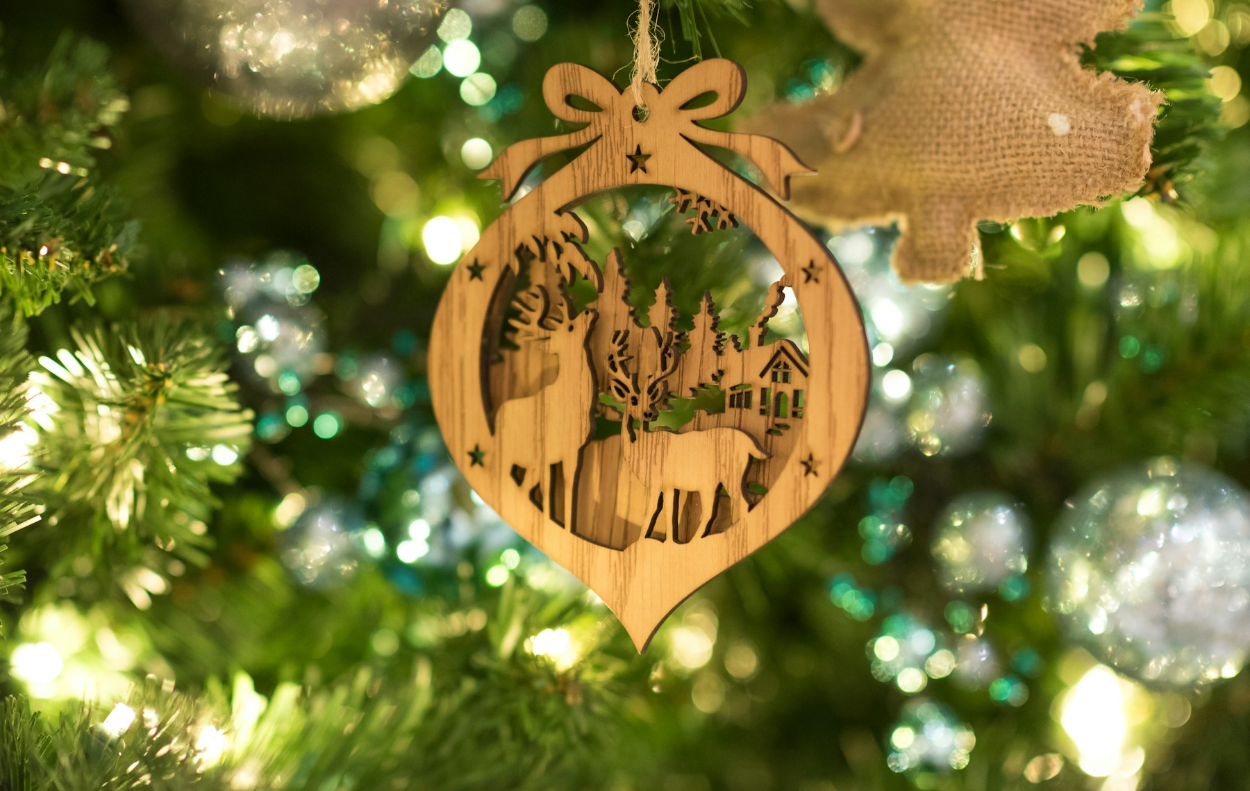 Deer ornament made from wine corks hanging on a tree