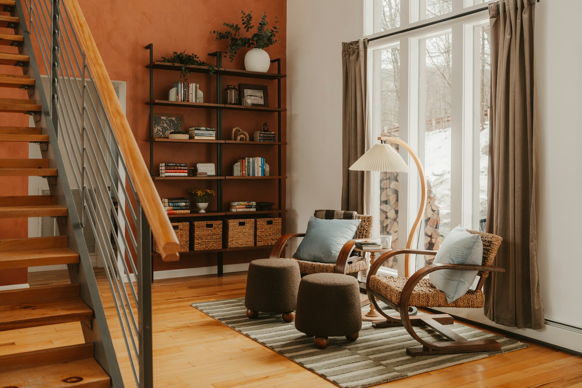 Cozy reading corner with a striped rug over a wooden floor