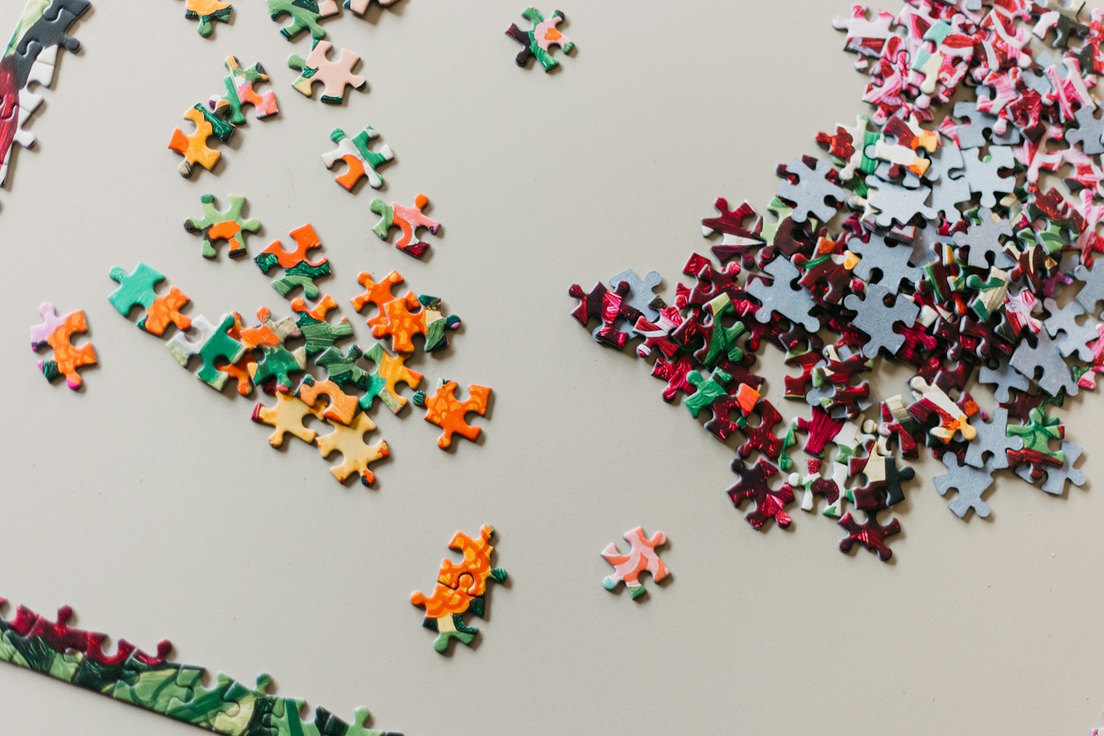 Colorful jigsaw puzzle pieces spread on a table