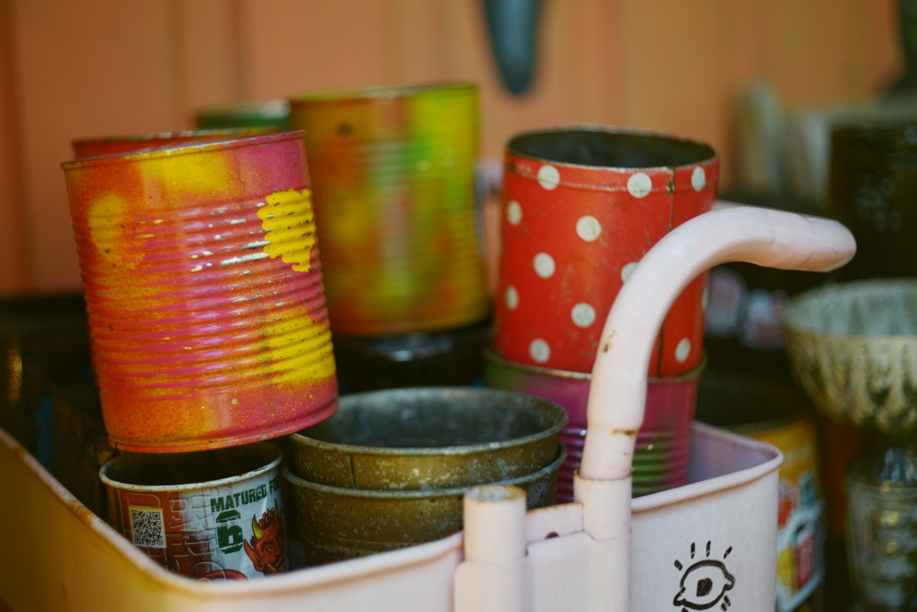 Decorated tin cans and craft supplies, recycled Christmas decorations in progress