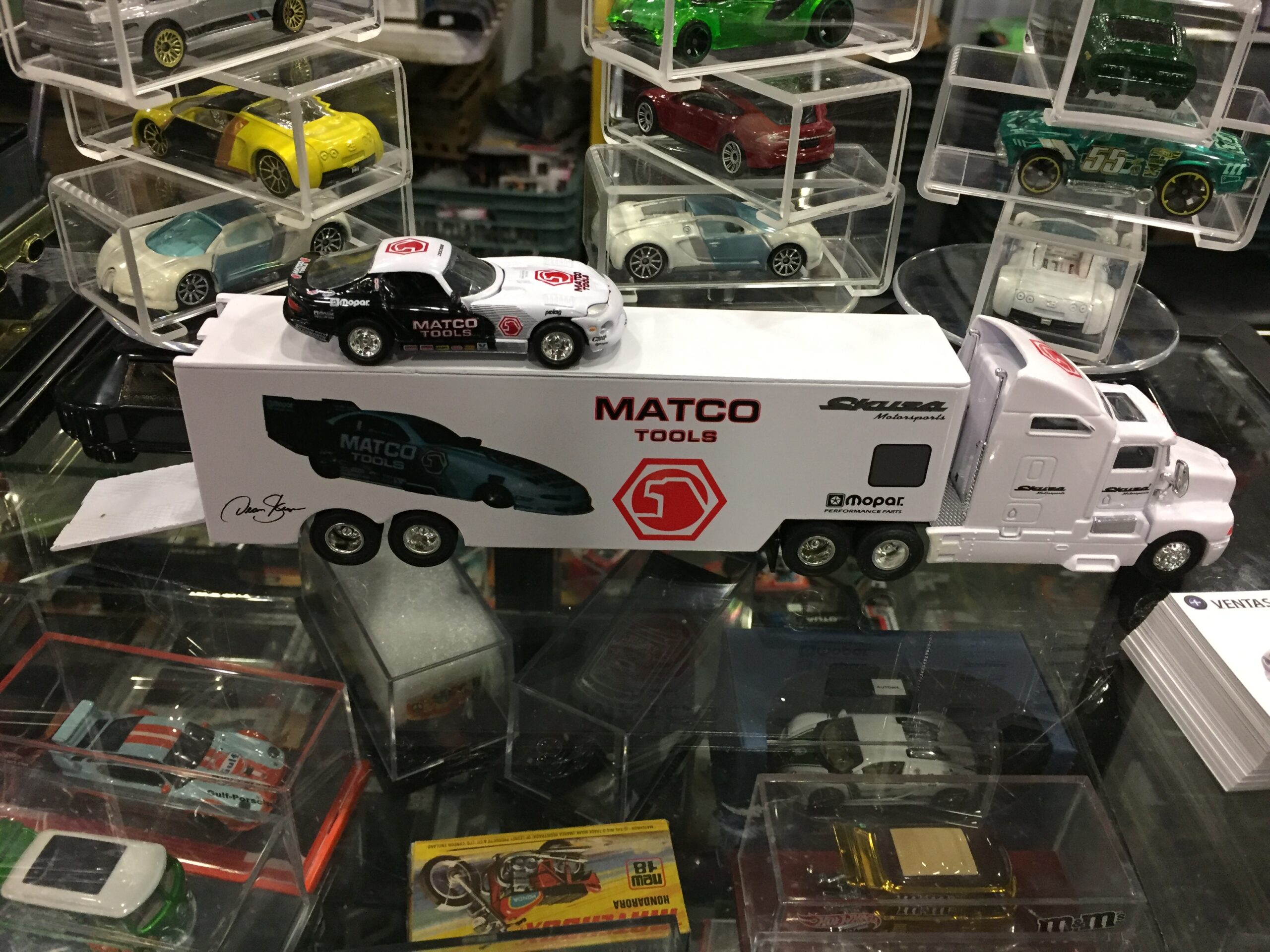 Model big rig truck with a car carrier trailer at a diecast collectors convention