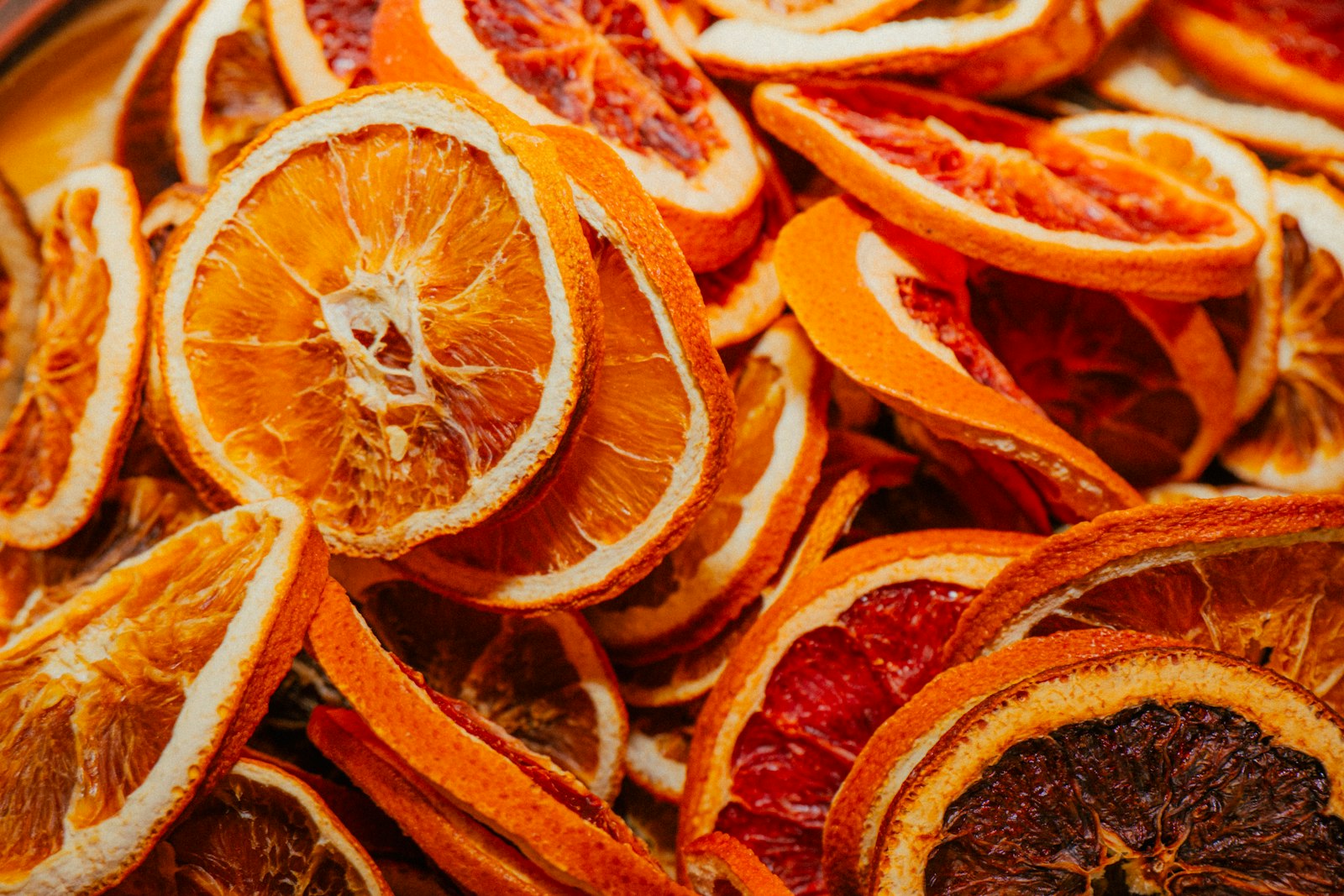 Pile of dried orange slices mixed with deep red blood orange slices