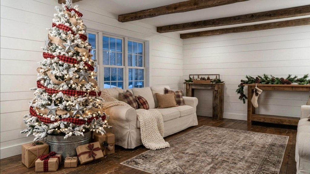 Flocked tree with buffalo check ribbon and galvanized stars in a farmhouse room