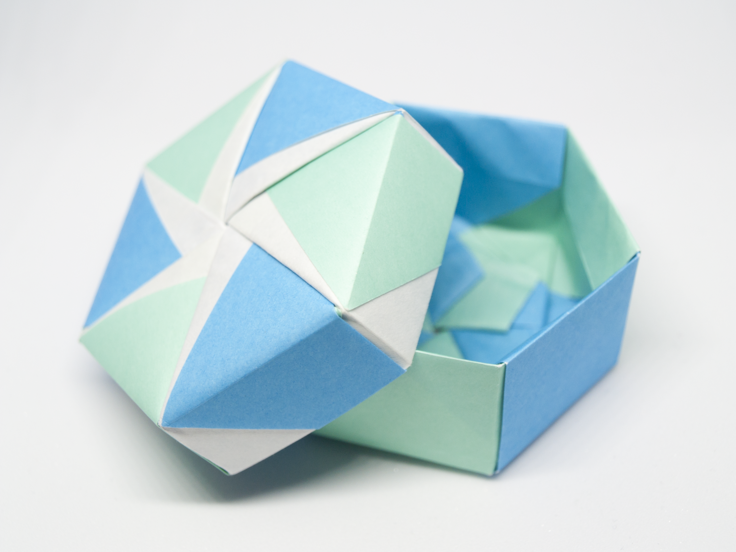 Hexagon DIY Christmas gift boxes idea, a modular origami box with a six petal lid