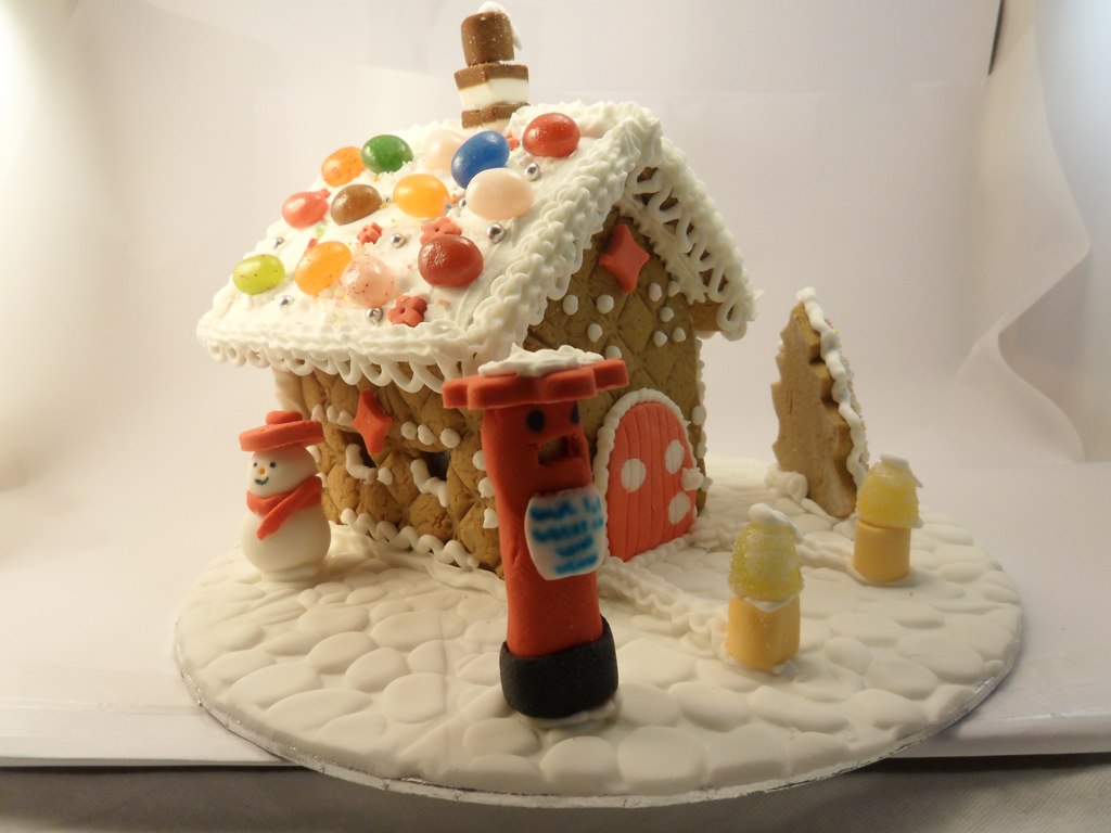 Decorated gingerbread house with candy and icing