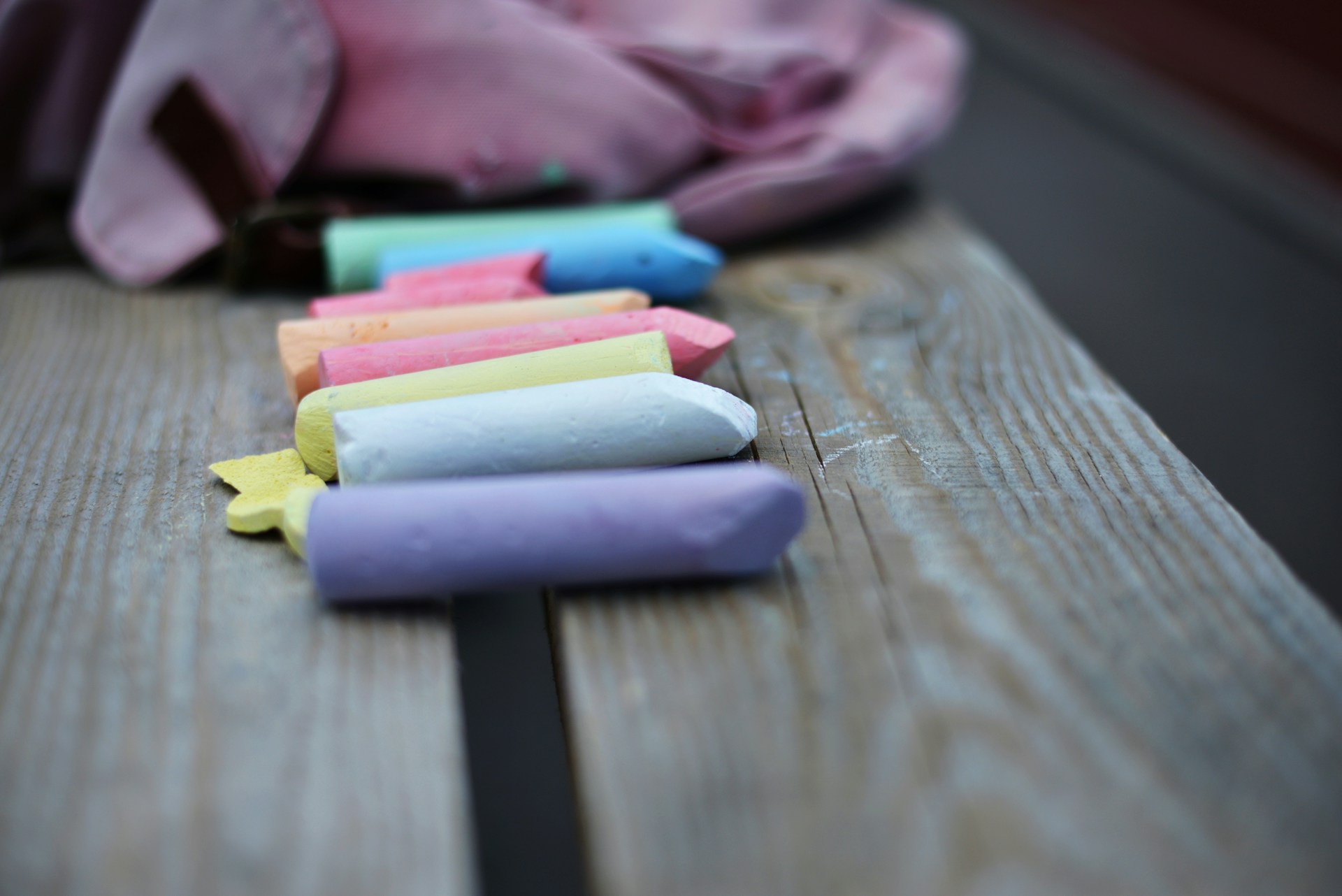Pastel chalk sticks on a wooden table
