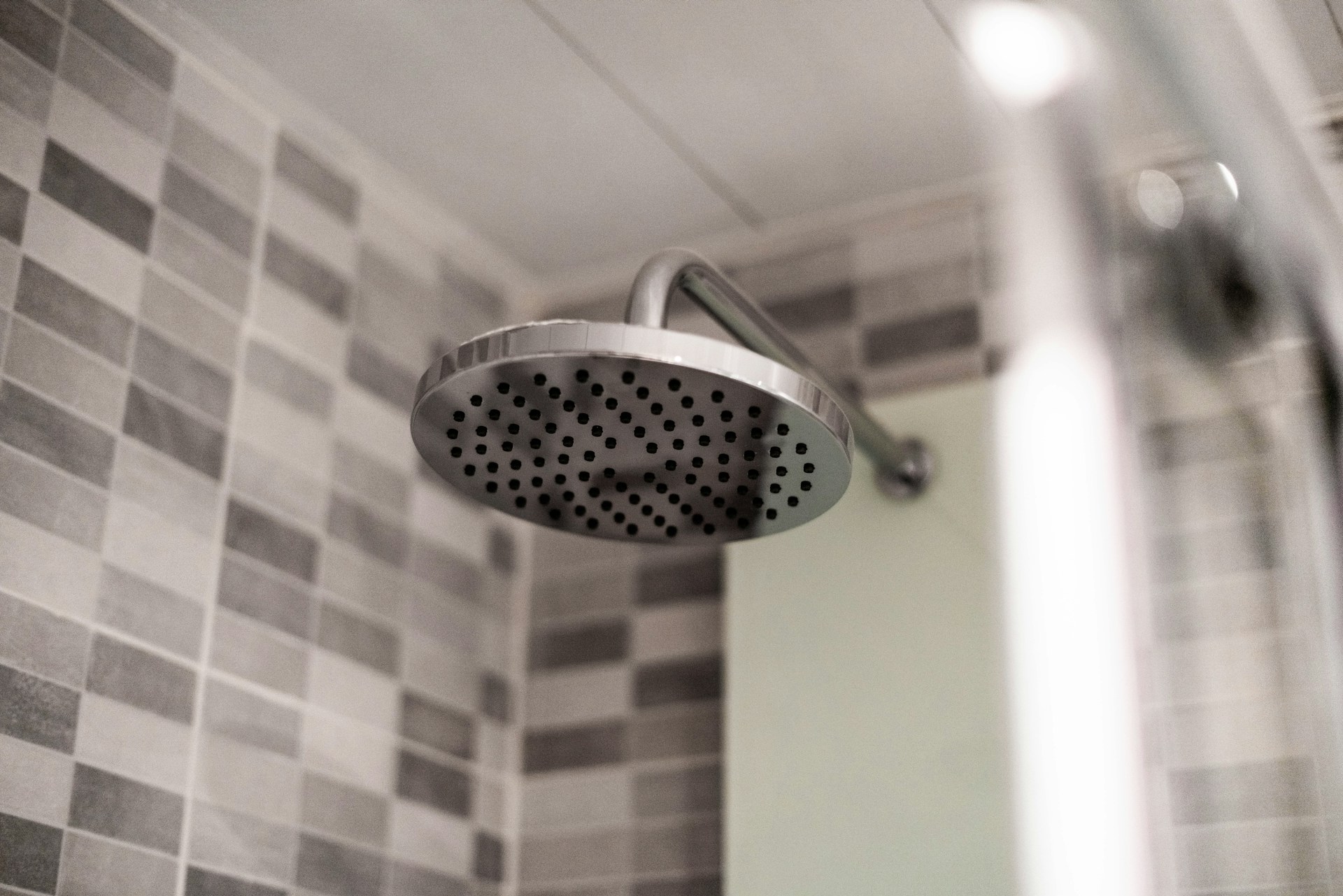 Old school household hacks vinegar soak for a round metal shower head