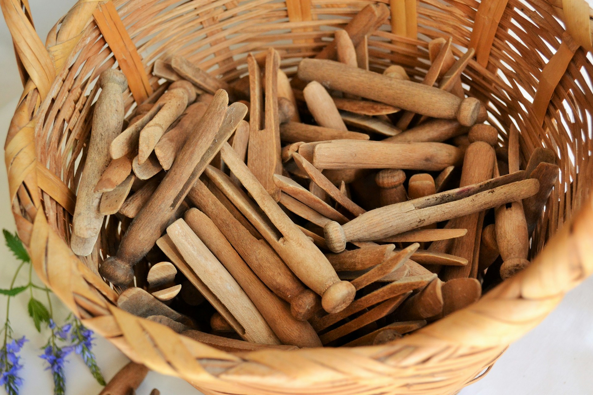 Old school household hacks basket of wooden clothespins for holding nails