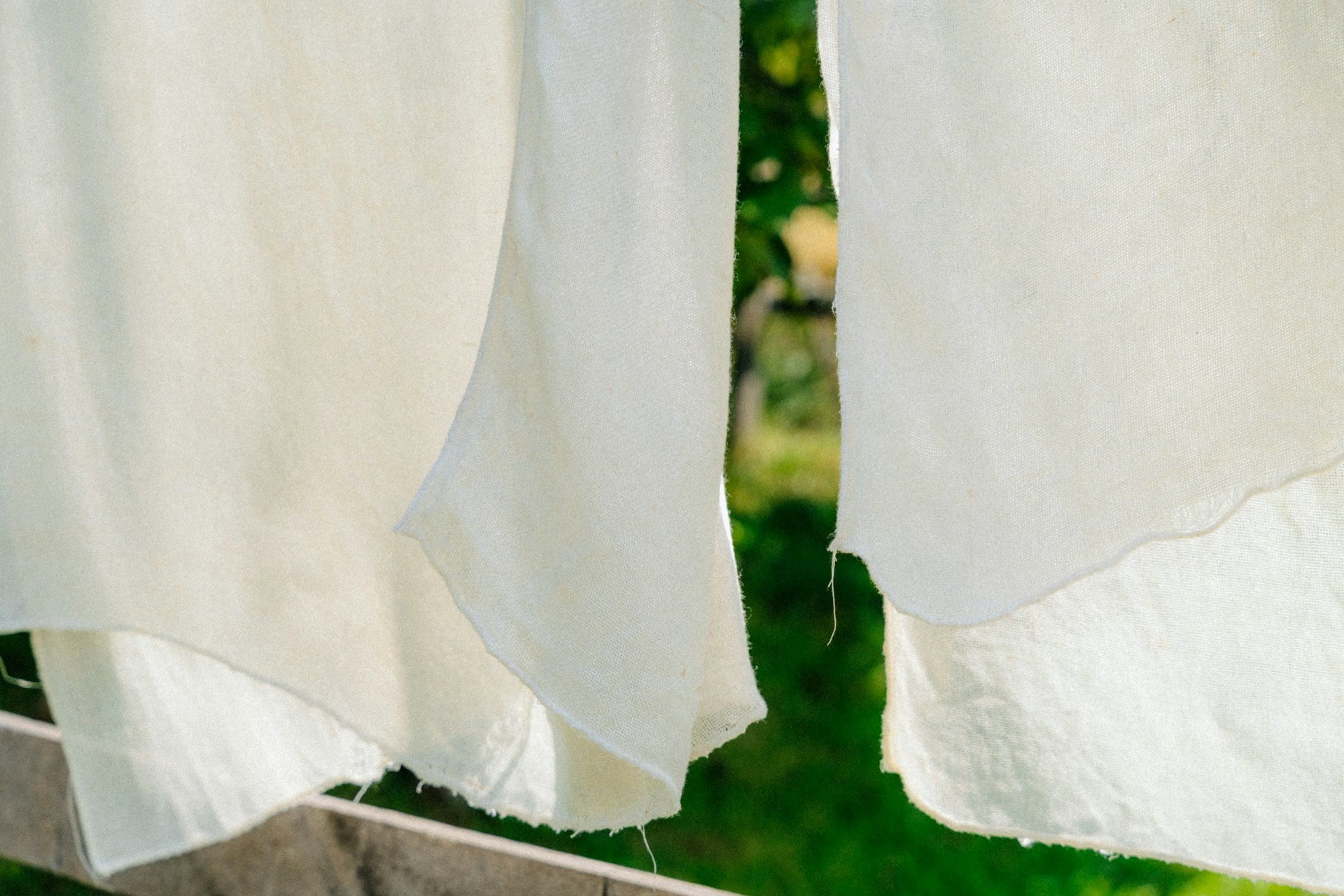 Holiday stain removal with sunshine as white linens dry on a line