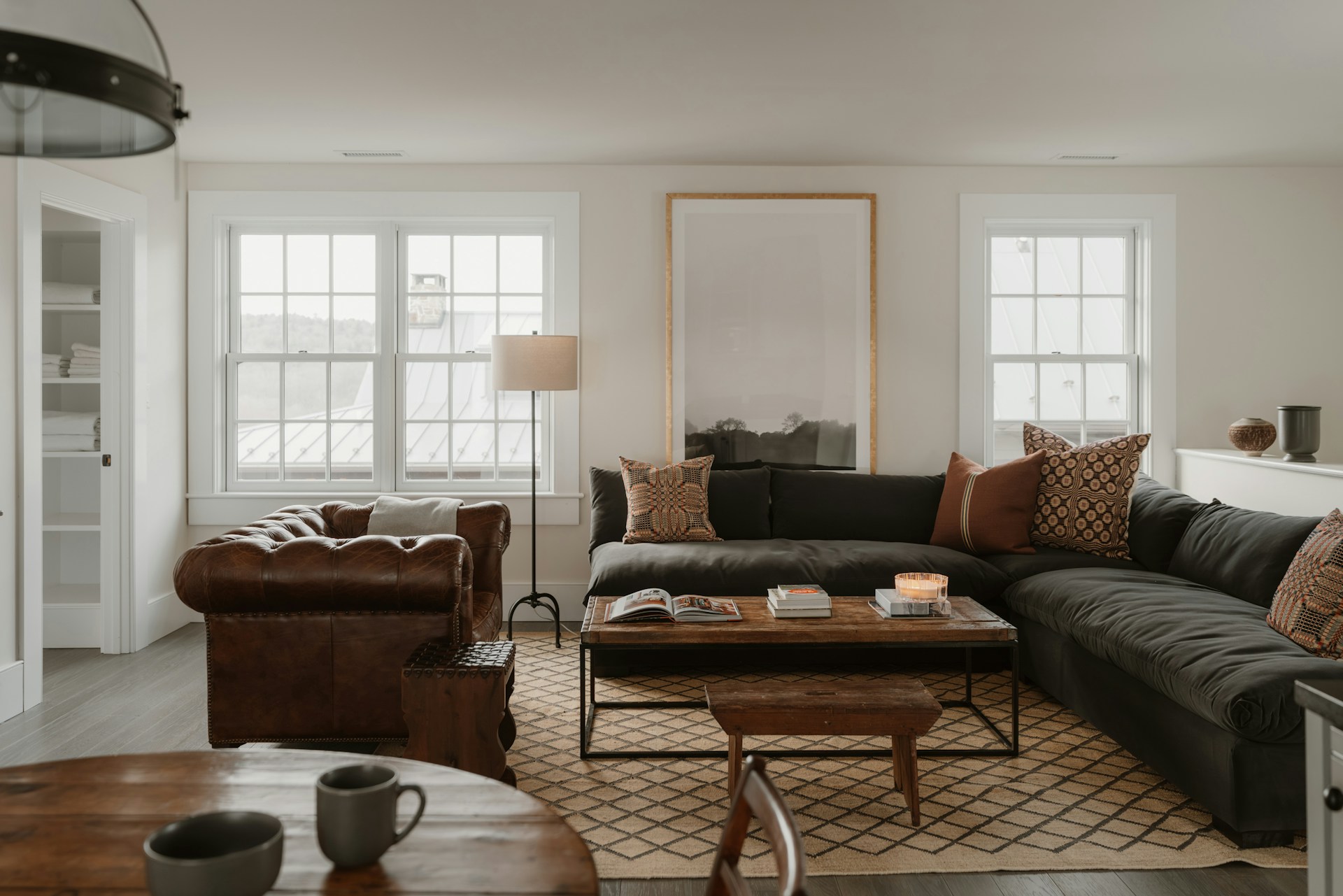 Cozy living room with a patterned rug, sectional sofa and coffee table