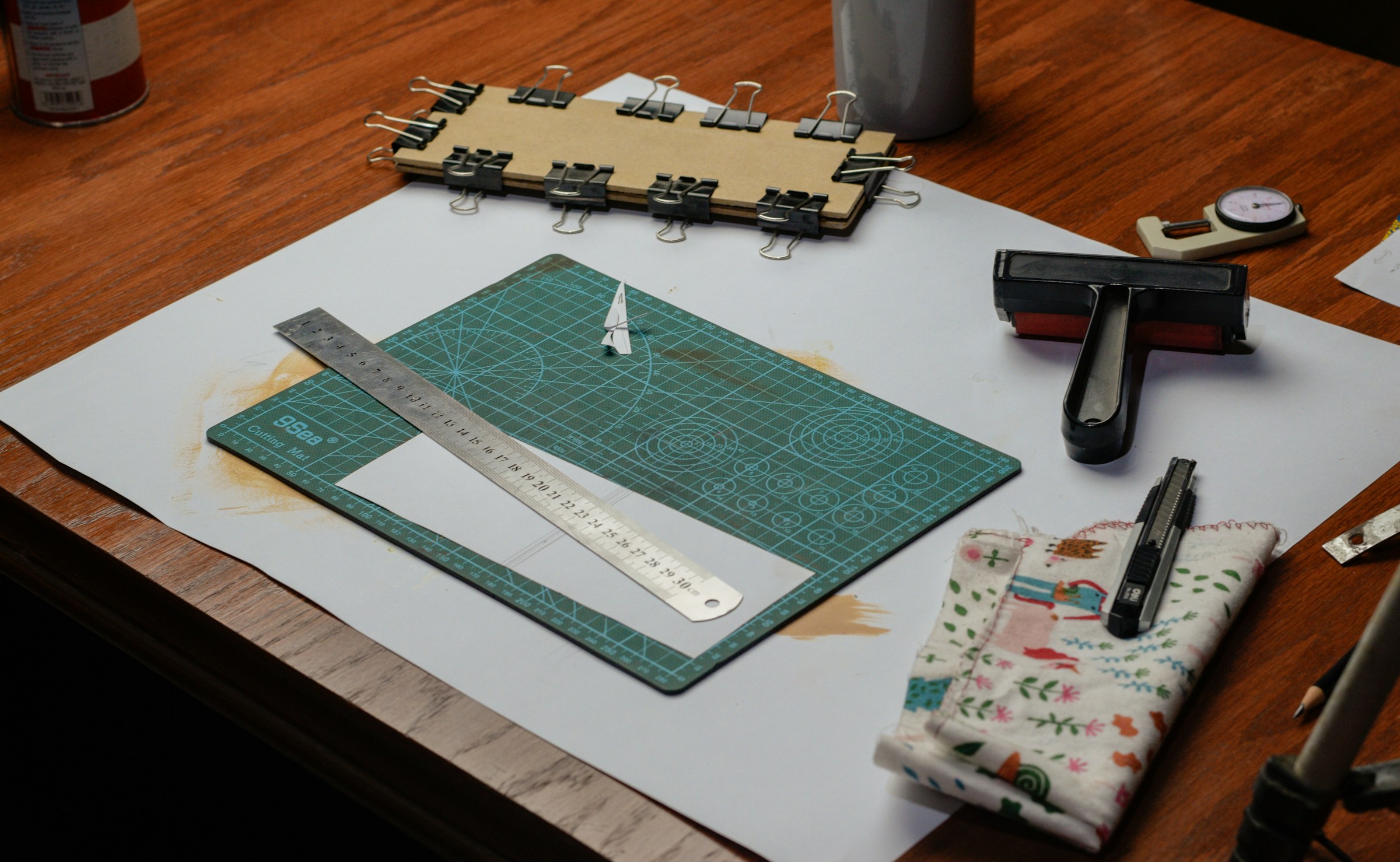 Maker workbench with a cutting mat and hand tools