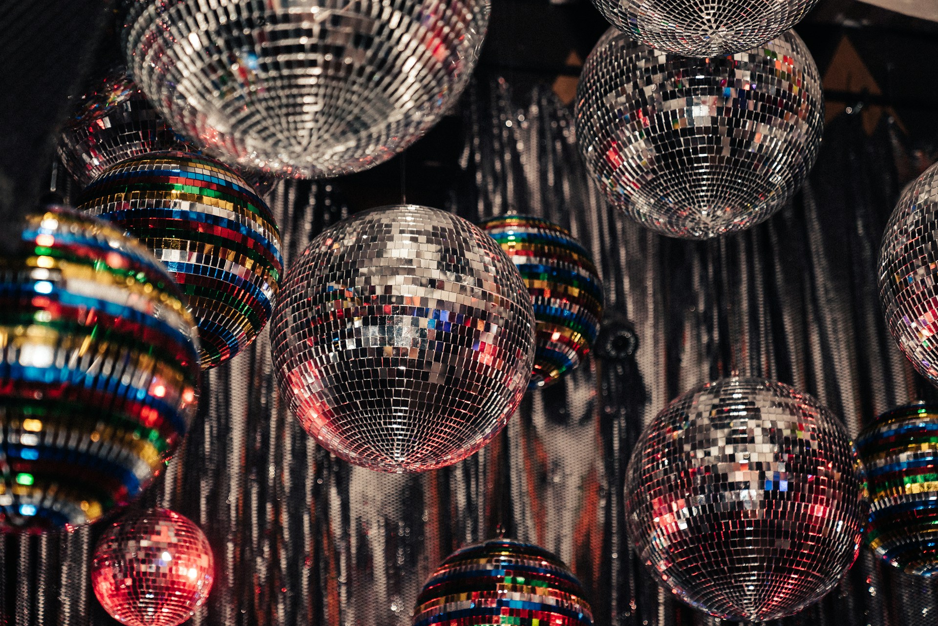 Hanging mirror ball ornaments of different sizes