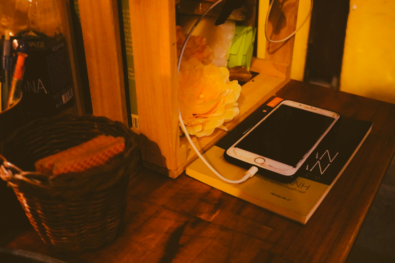 Phone charging on a wooden table