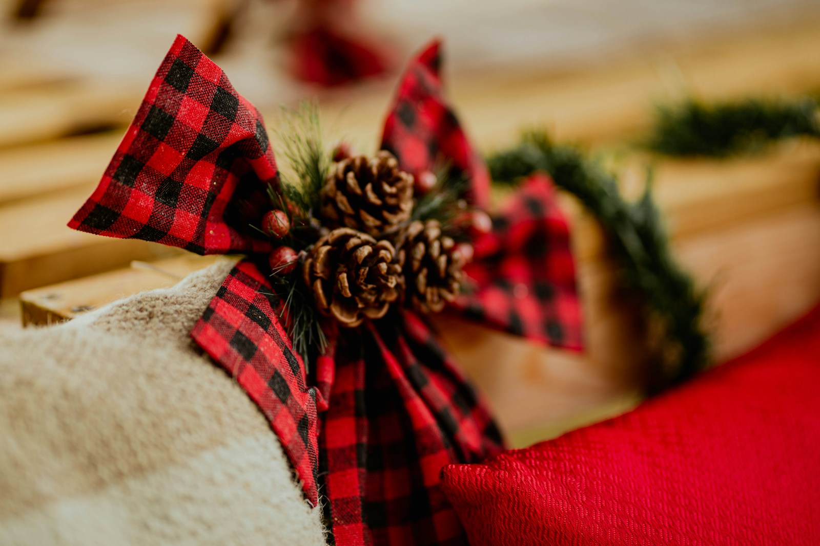Taylor Swift Christmas garland idea with pine cones and a plaid bow