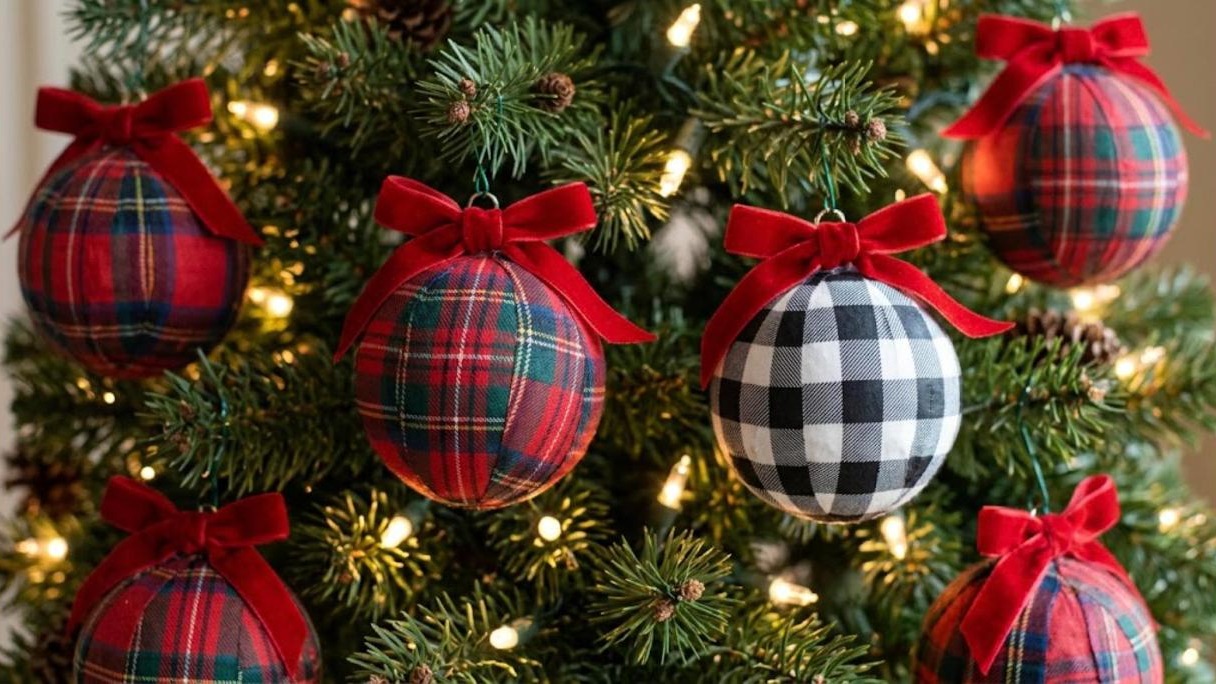 Plaid fabric ornament makeovers in red tartan and buffalo check with red velvet bows on a tree