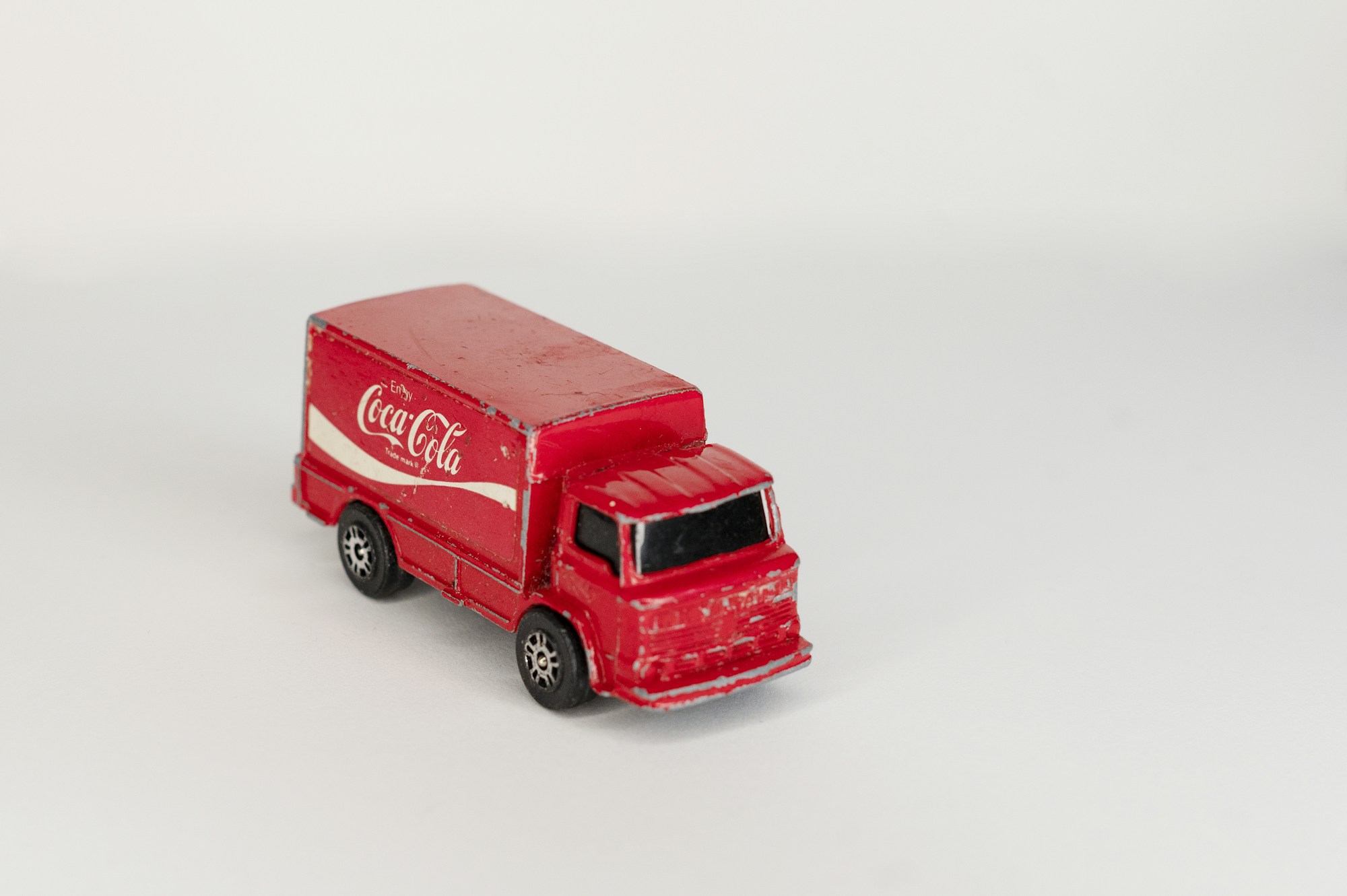 A red and white toy truck, the kind of toy worth saving