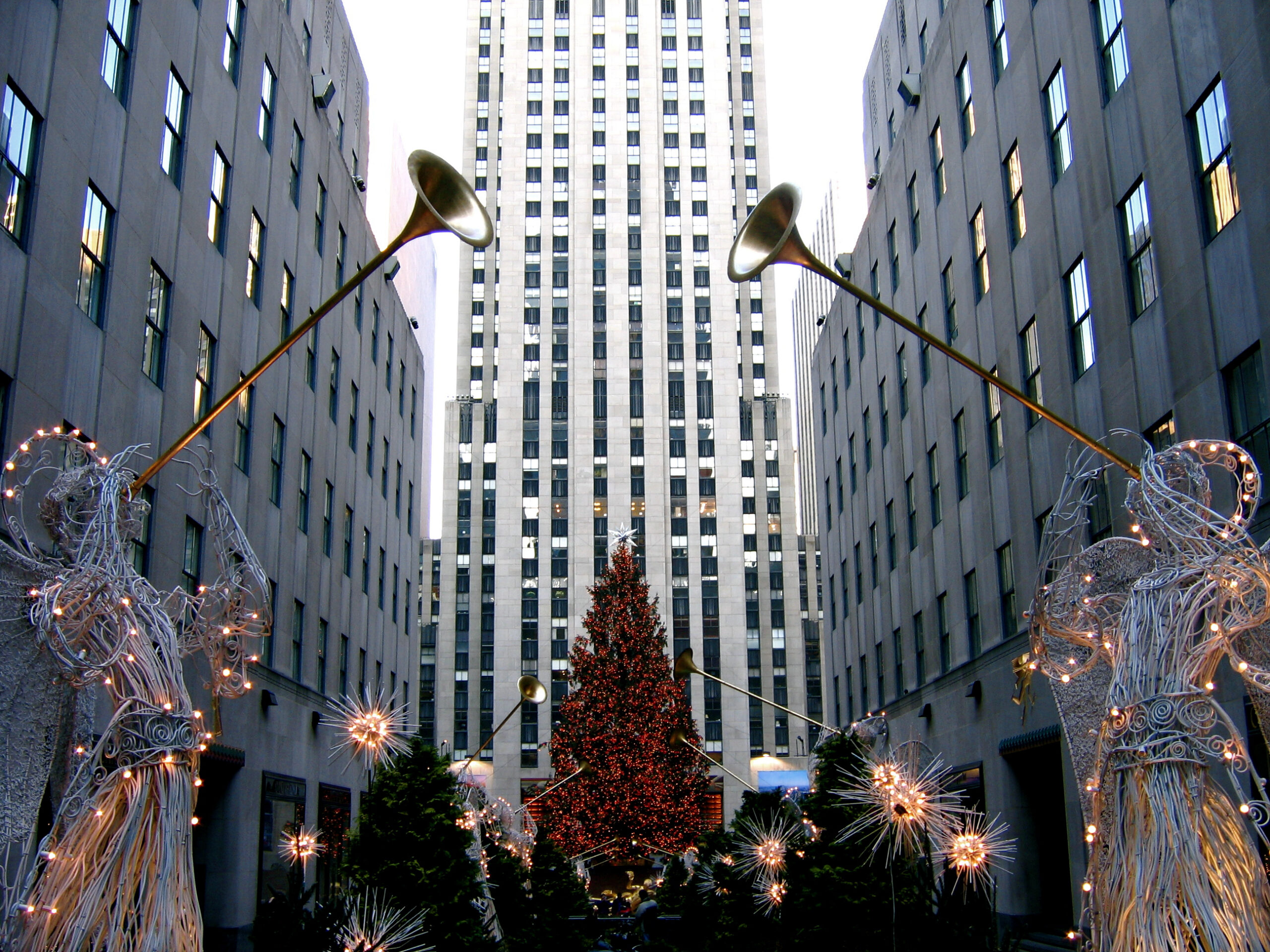 Rockefeller Center Christmas wire herald angels in the Channel Gardens in front of the tree