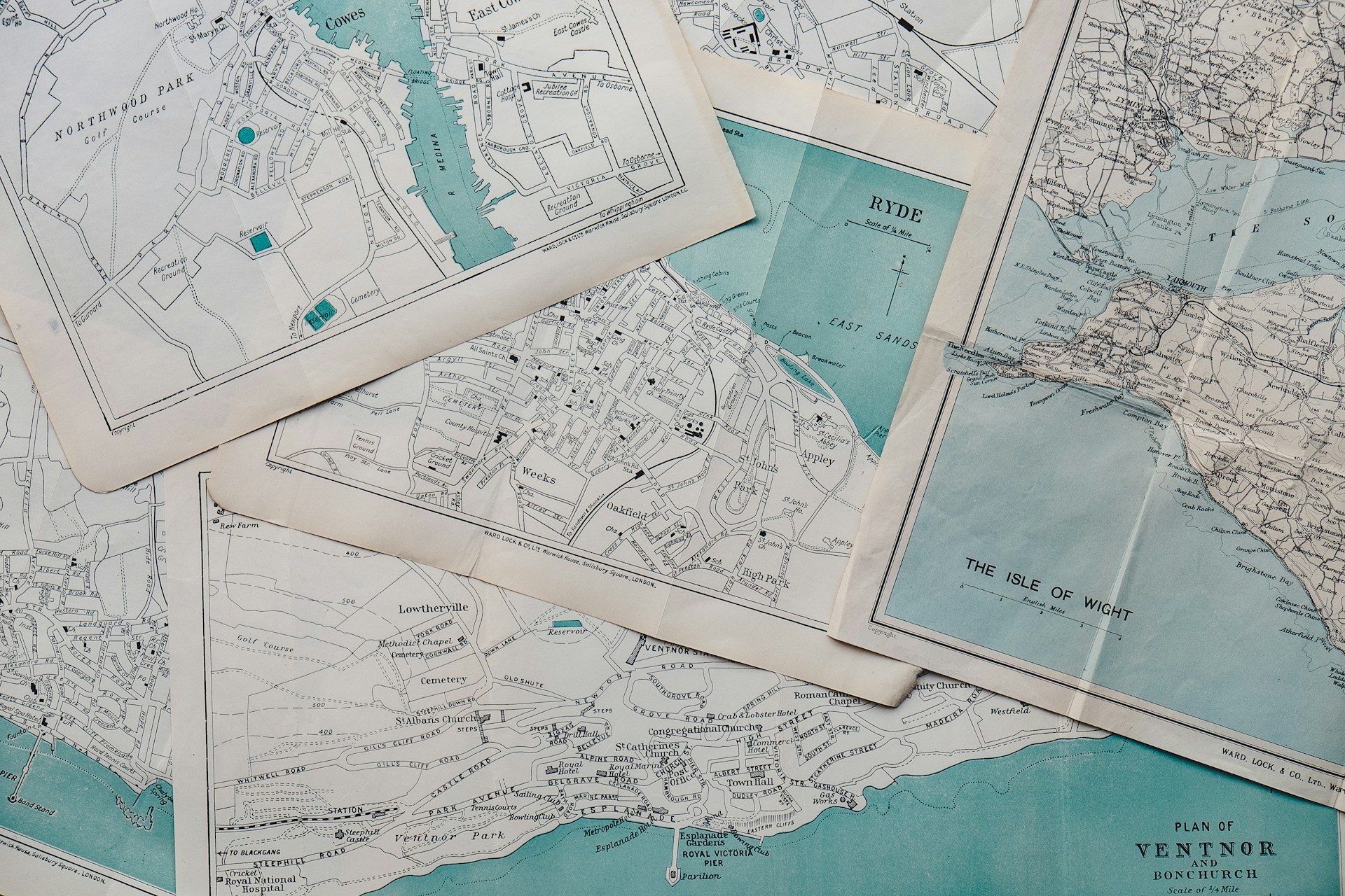 Vintage paper maps spread out on a table