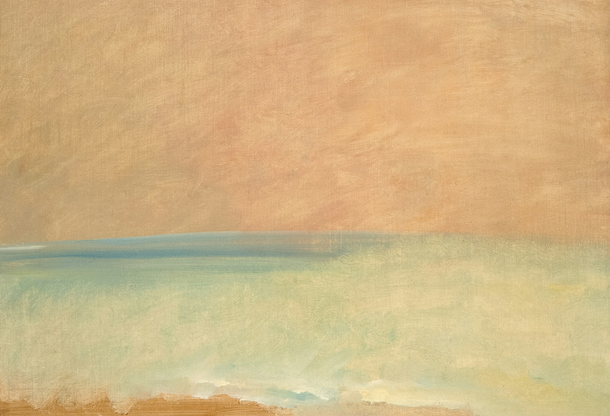 Soft peach sky over a calm sea with a glowing horizon line