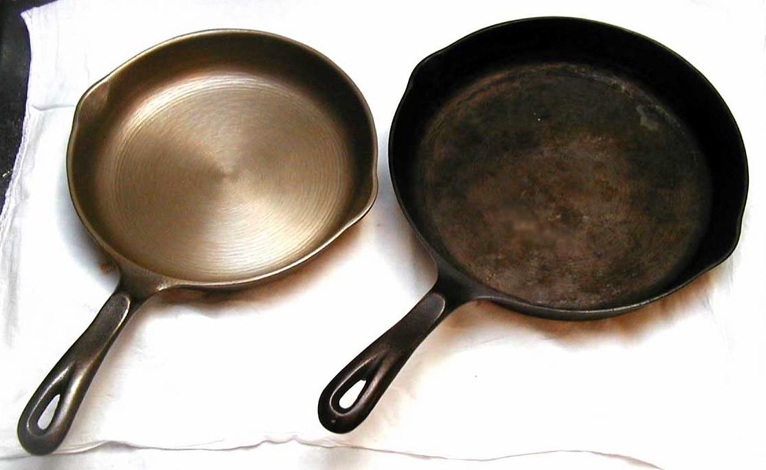 A stripped bare cast iron skillet beside a dark seasoned one