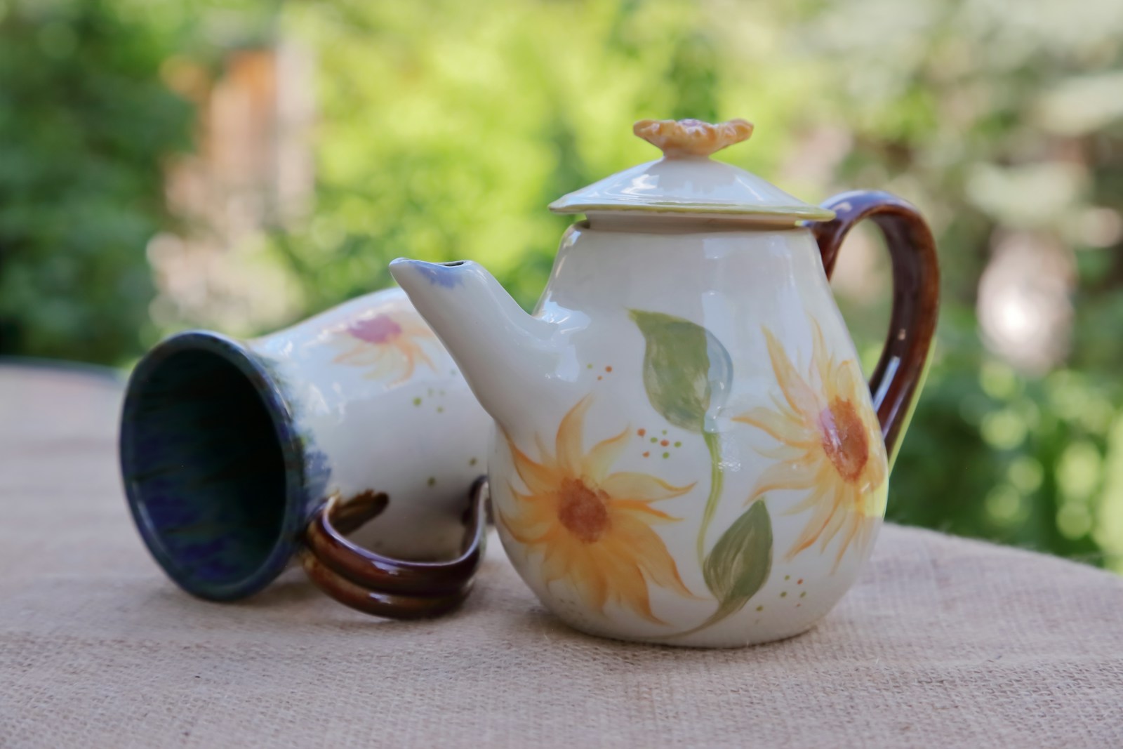 Hand painted ceramic teapot and mug with sunflowers