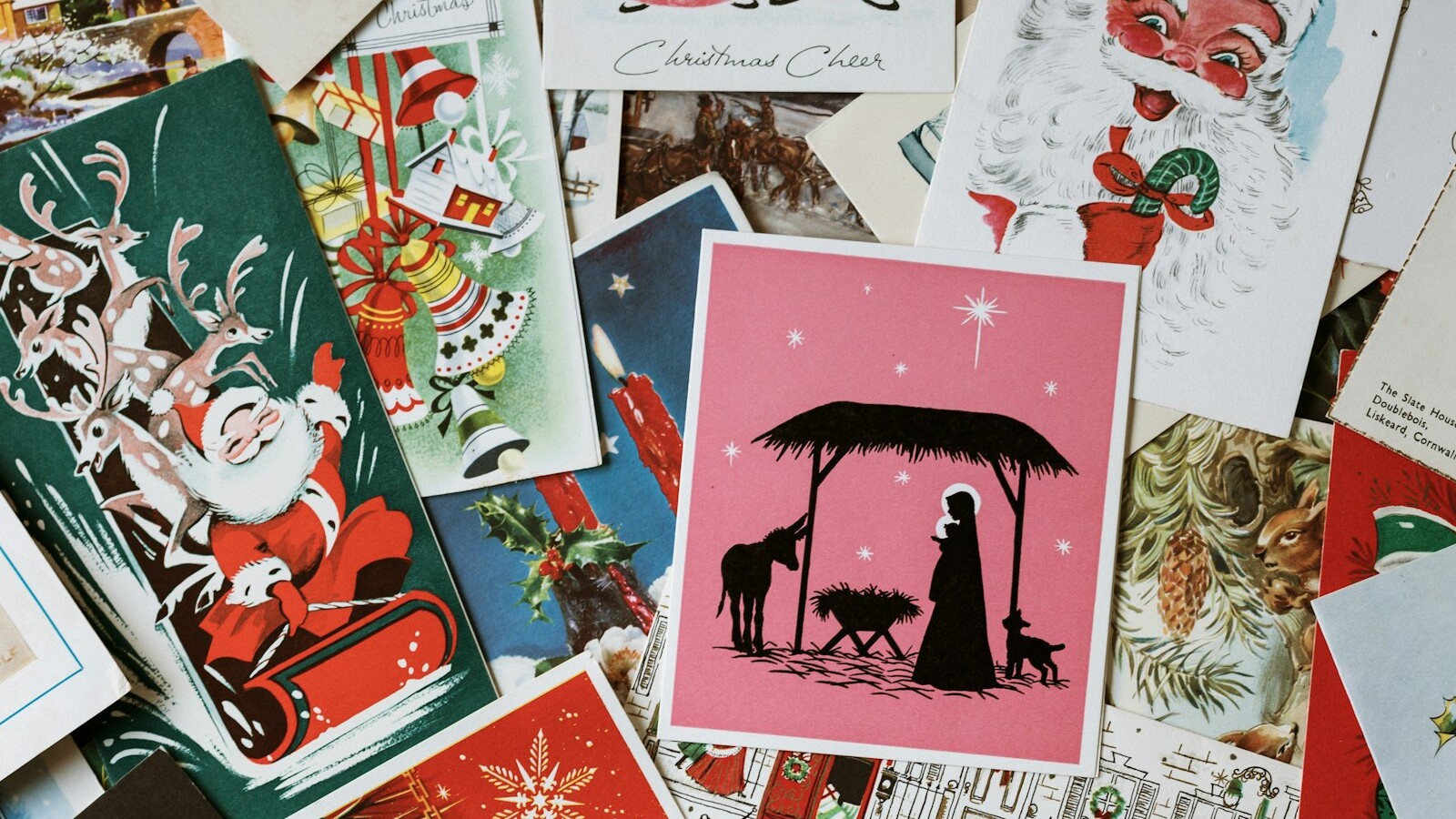 A pile of vintage 1960s style Christmas cards in red, white and blue