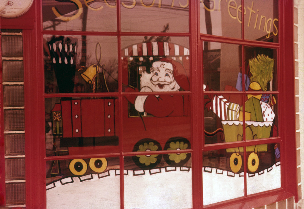 Vintage hand painted shop window with a Santa train scene