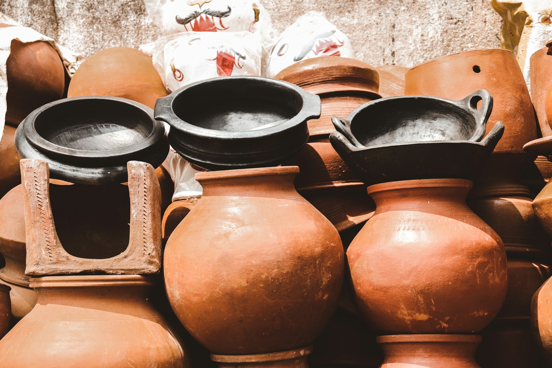 Winter home prep stack of clay pots ready to store