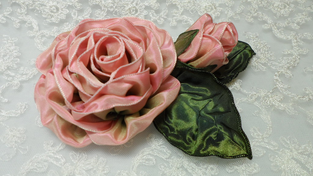 Pink wired ribbon rose with green ribbon leaves