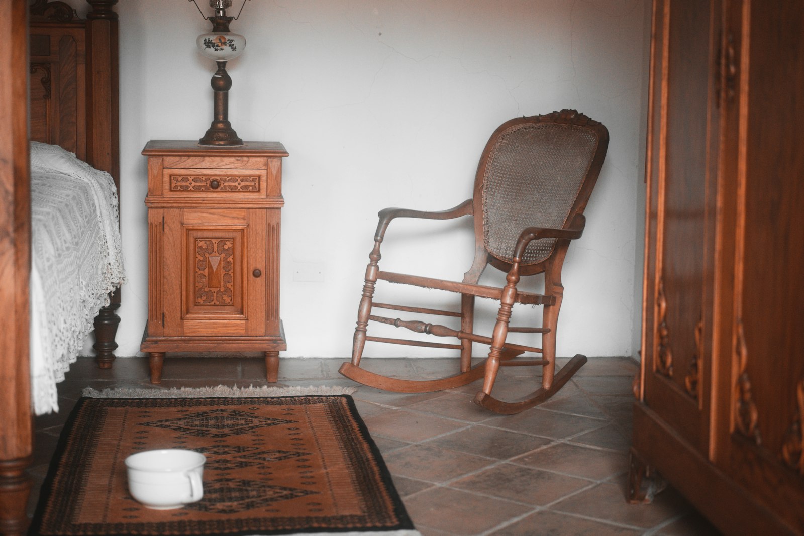 Wooden rocking chair in a quiet room with a rug
