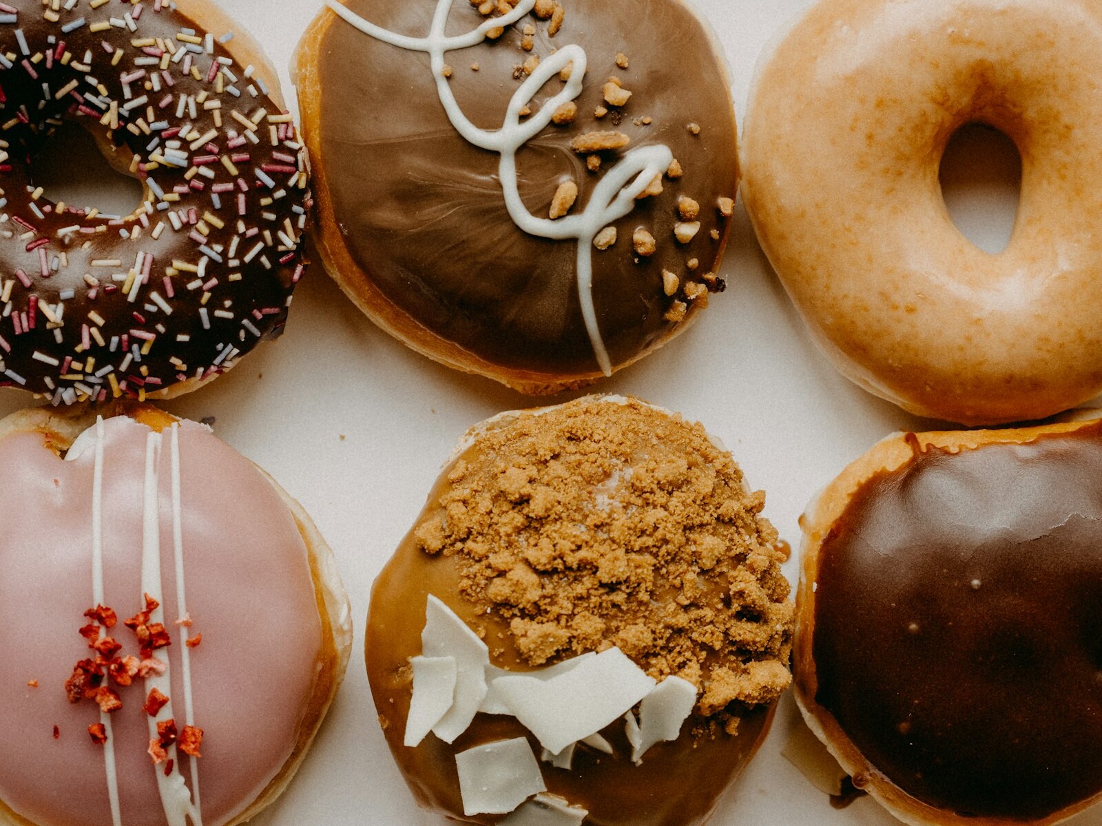 Assorted glazed and frosted donuts