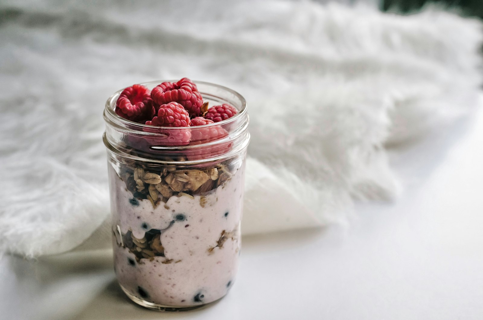 Overnight oats in a jar with raspberries