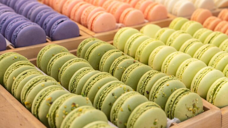 Tray of pistachio, lavender and peach French macarons