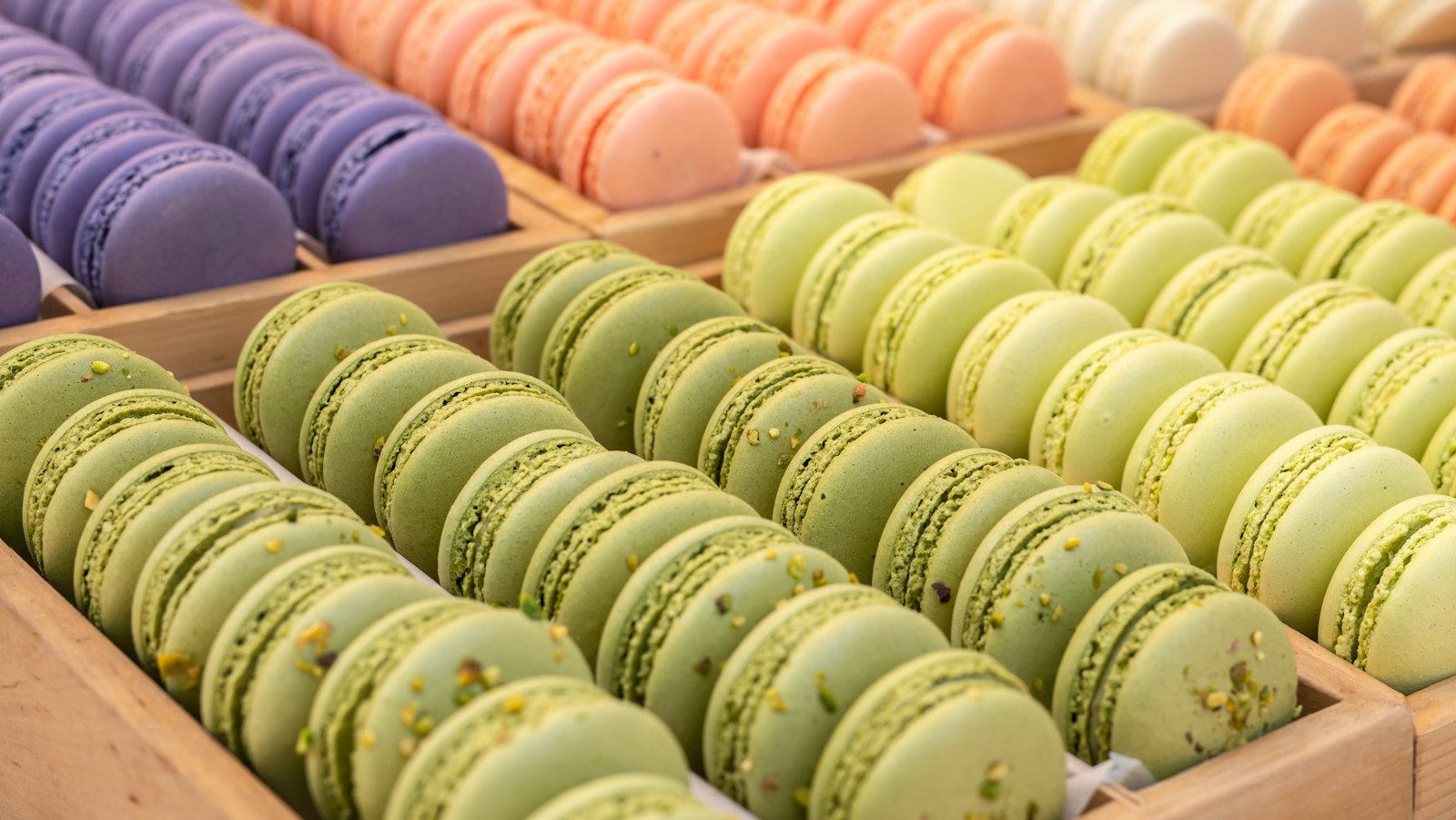 Tray of pistachio, lavender and peach French macarons
