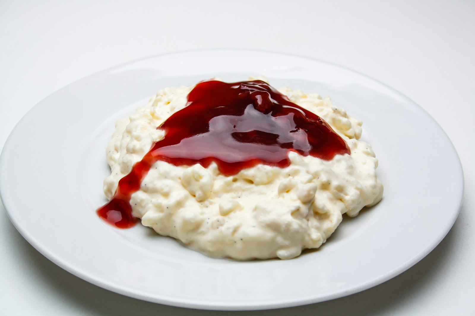 Creamy rice pudding with cherry sauce