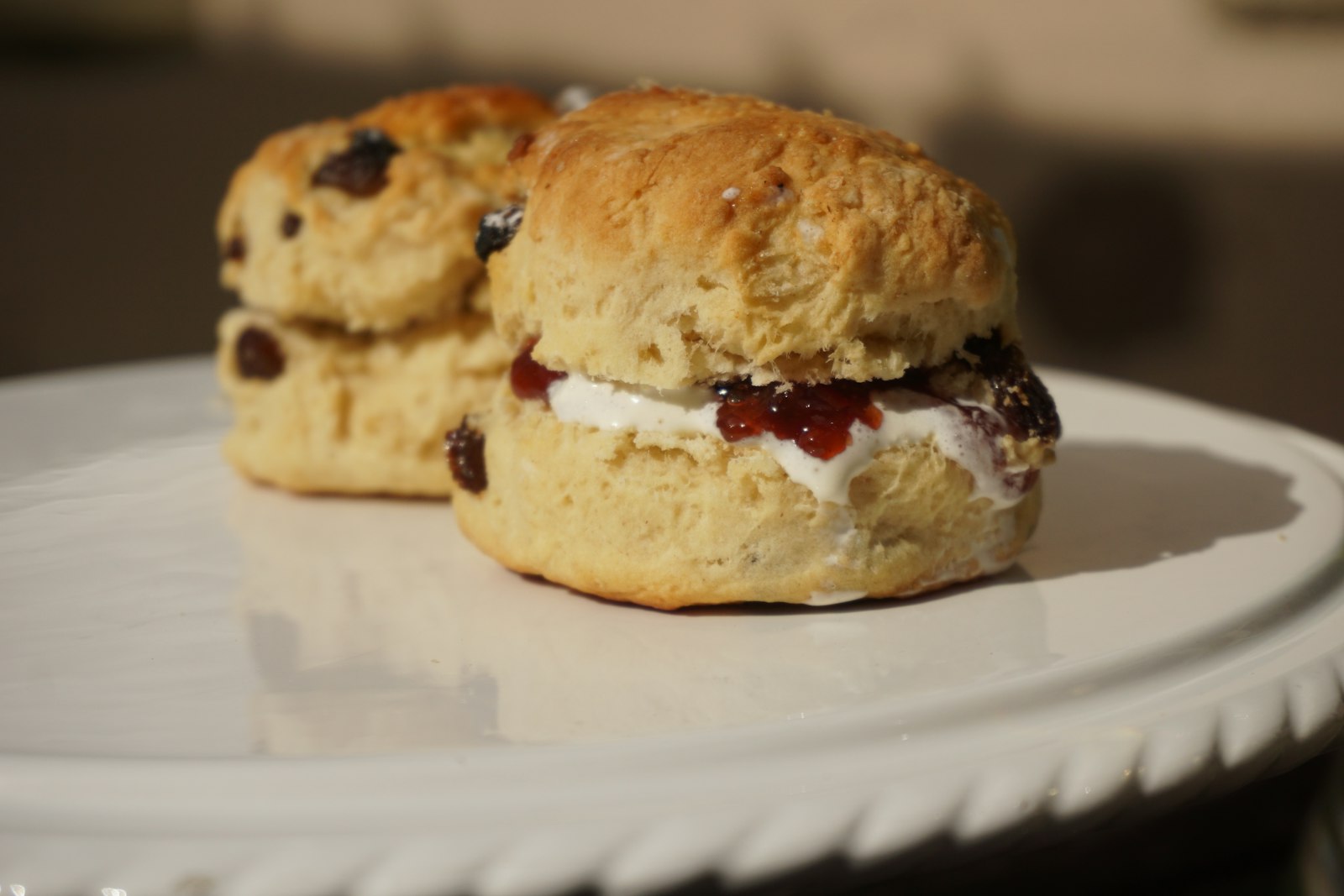 Homemade dinner rolls: scones with cream and jam