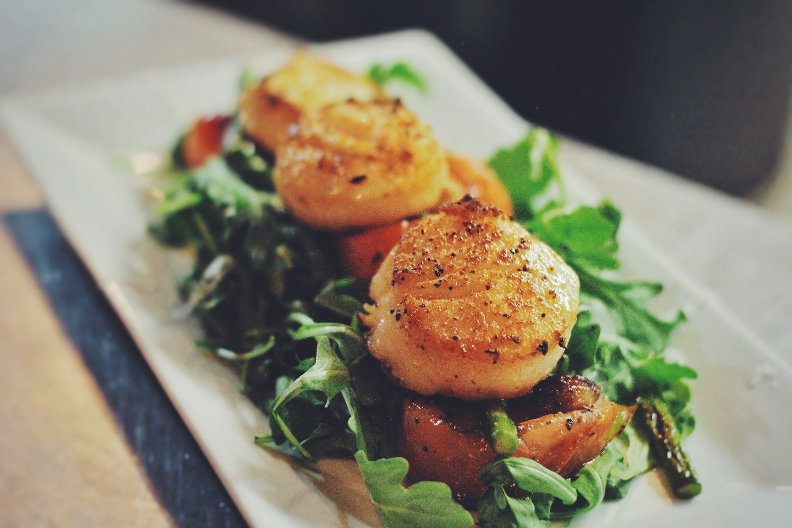 Golden seared scallops with greens