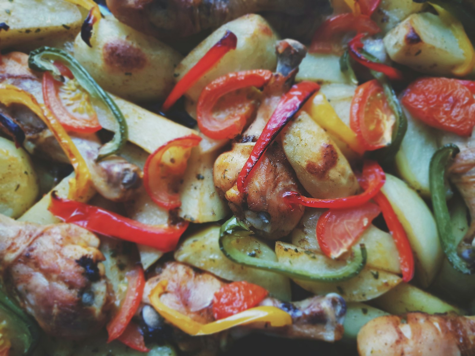 Roasted peppers and vegetables on a sheet pan
