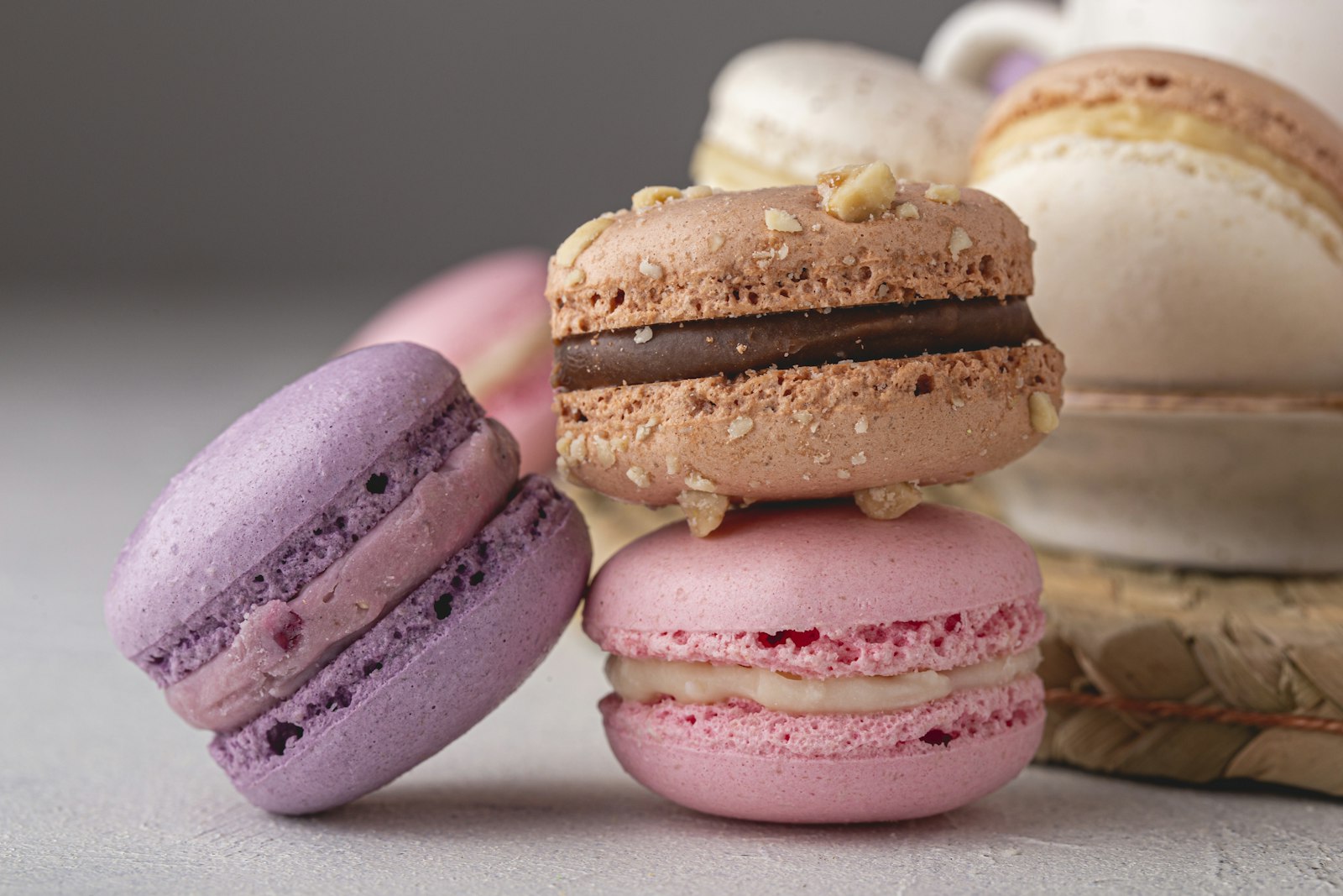 Stack of pink, purple and chocolate macarons