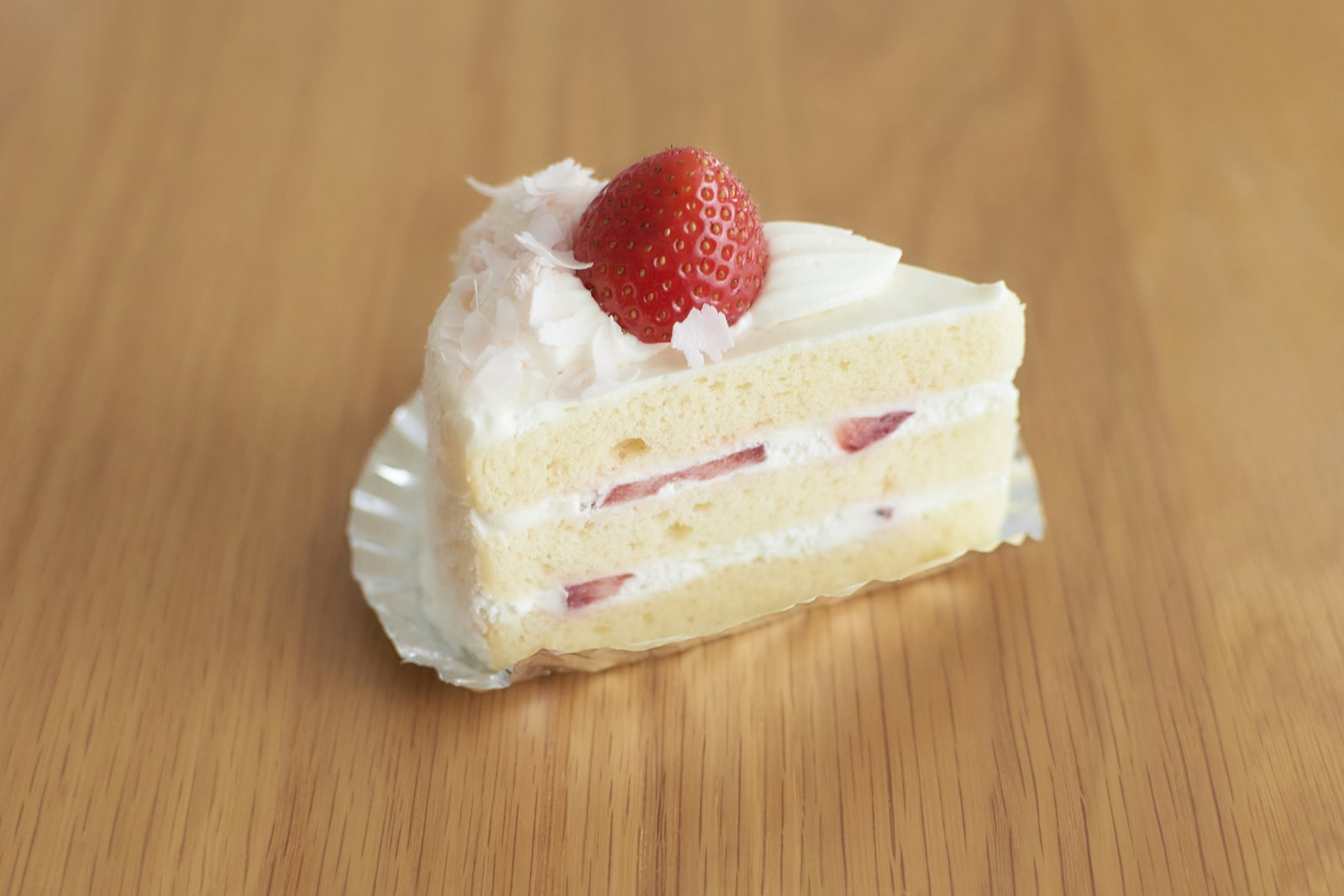 Slice of strawberry cream cake