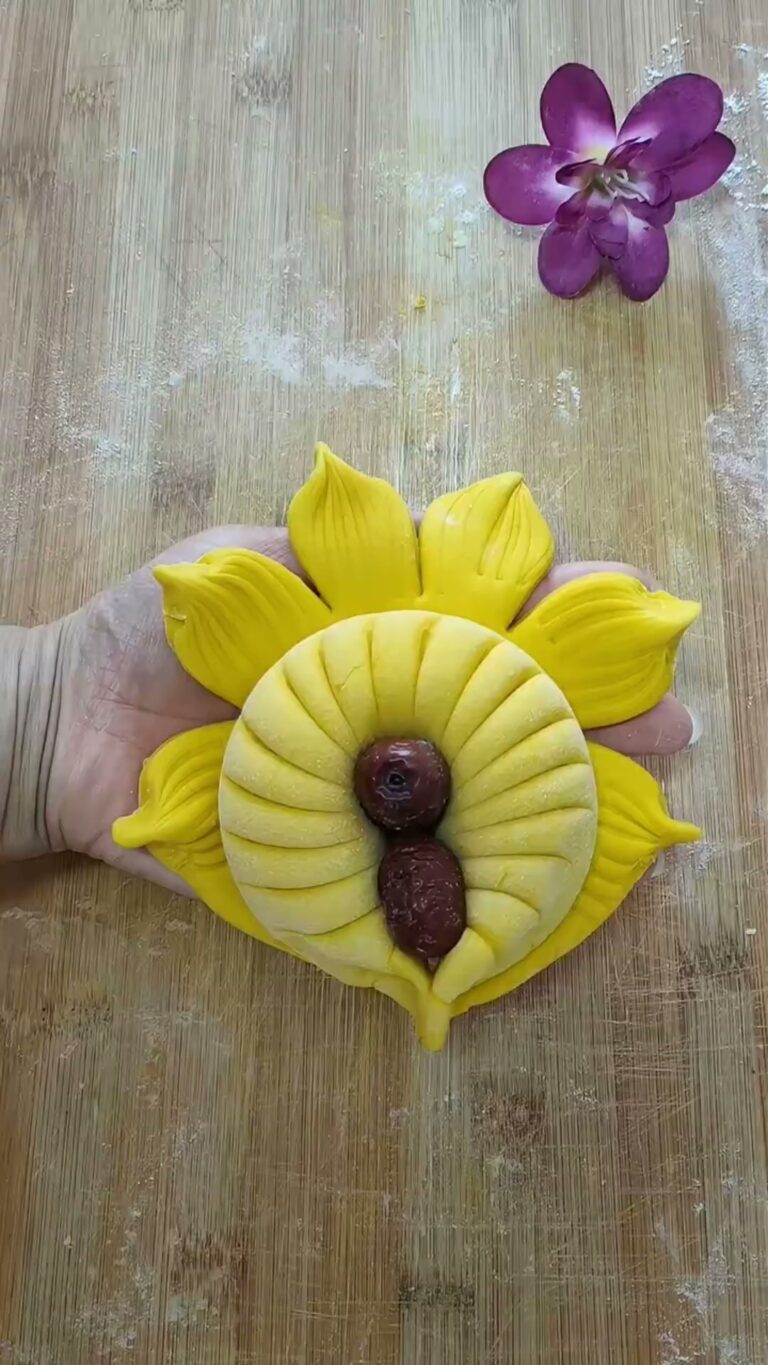 Sunflower dough art with yellow petals and dates in the center