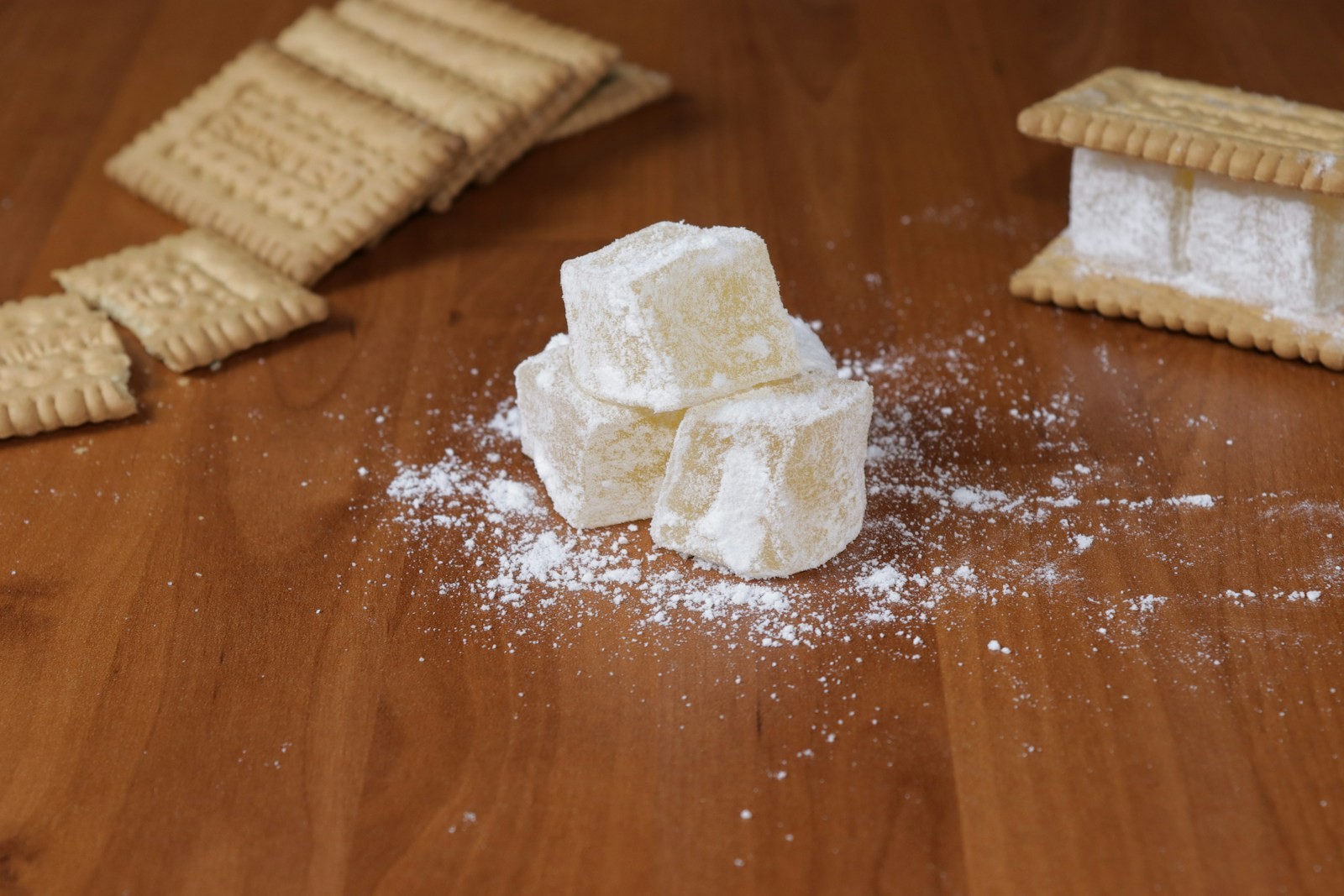 Sugar dusted cubes on a wooden board ready to store