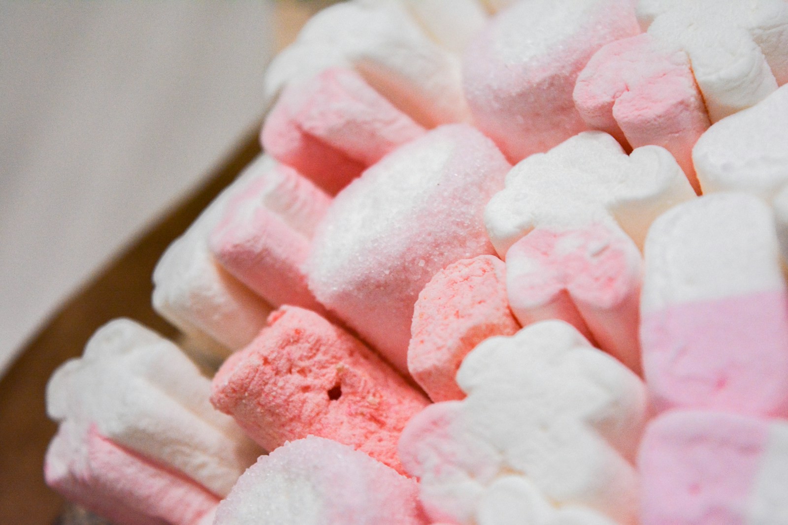Pink and white swirled squares piled together