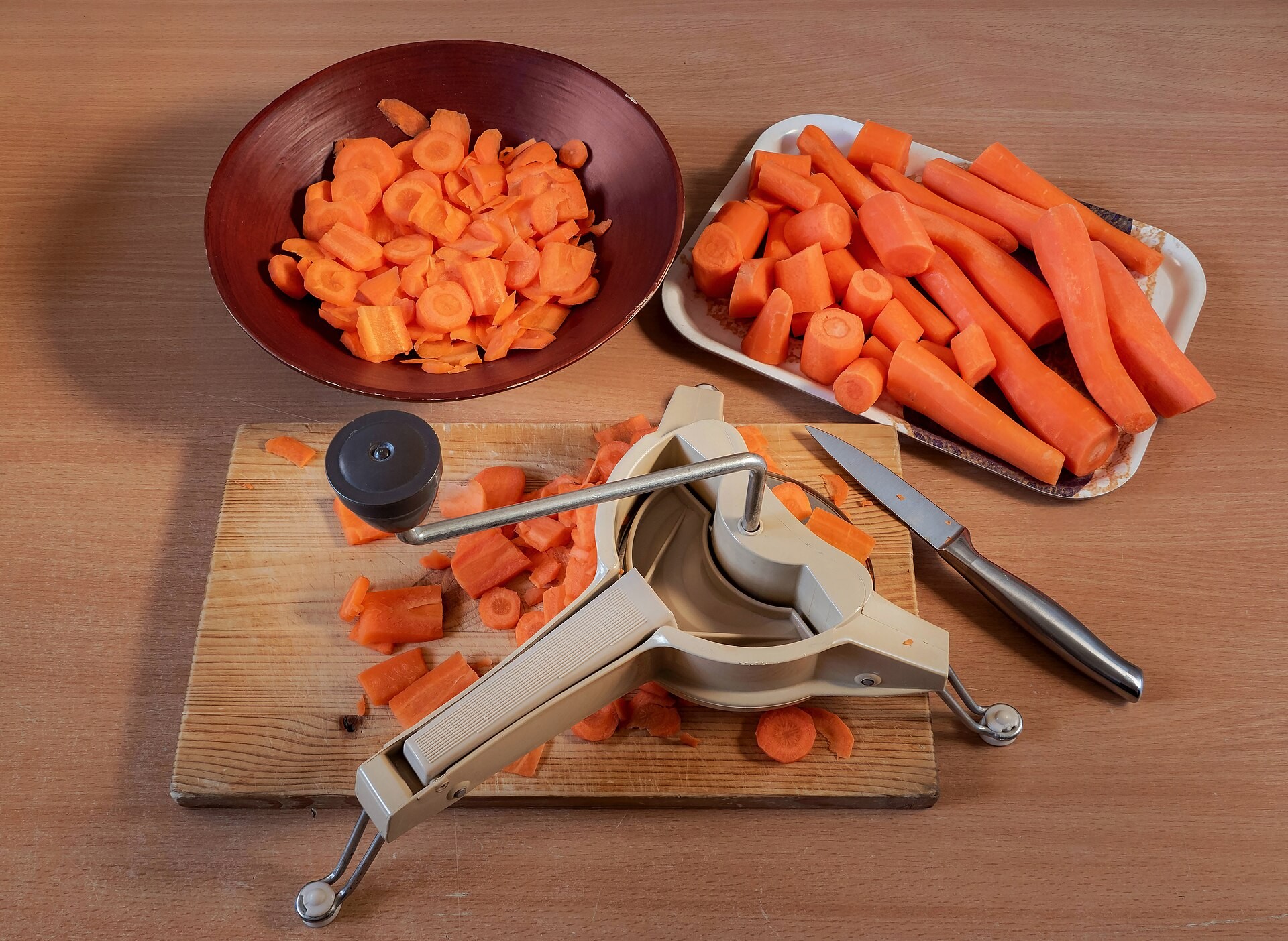 Sliced and grated carrots on a cutting board for jarred pasta sauce upgrades