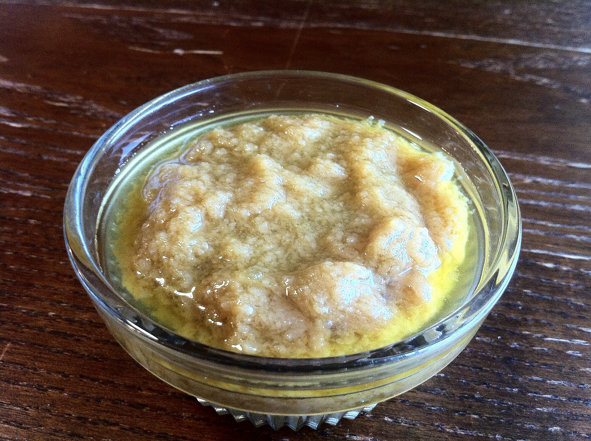 Bowl of soft roasted garlic confit for jarred pasta sauce upgrades