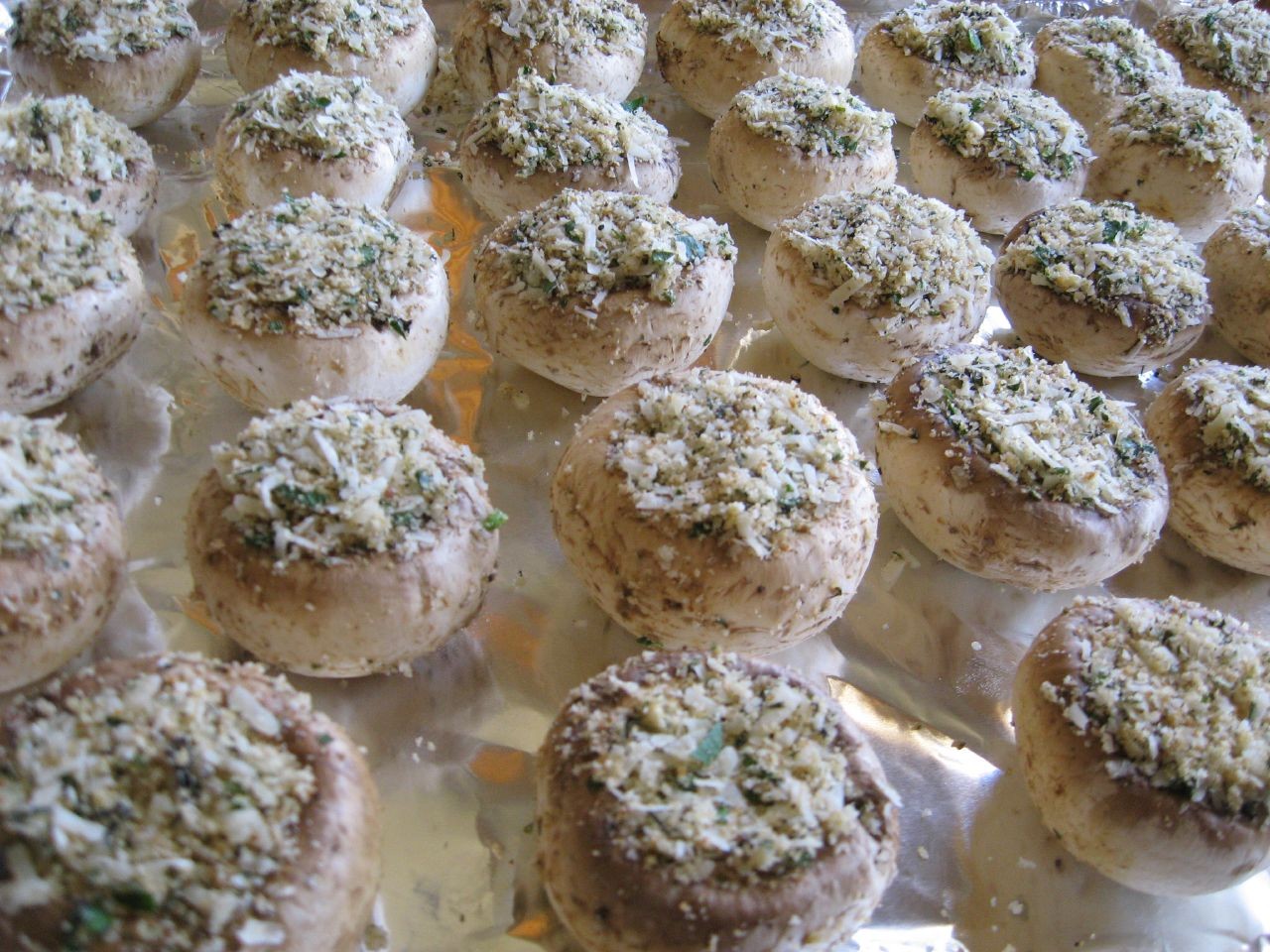 Rows of garlic herb breadcrumb caps ready for the oven
