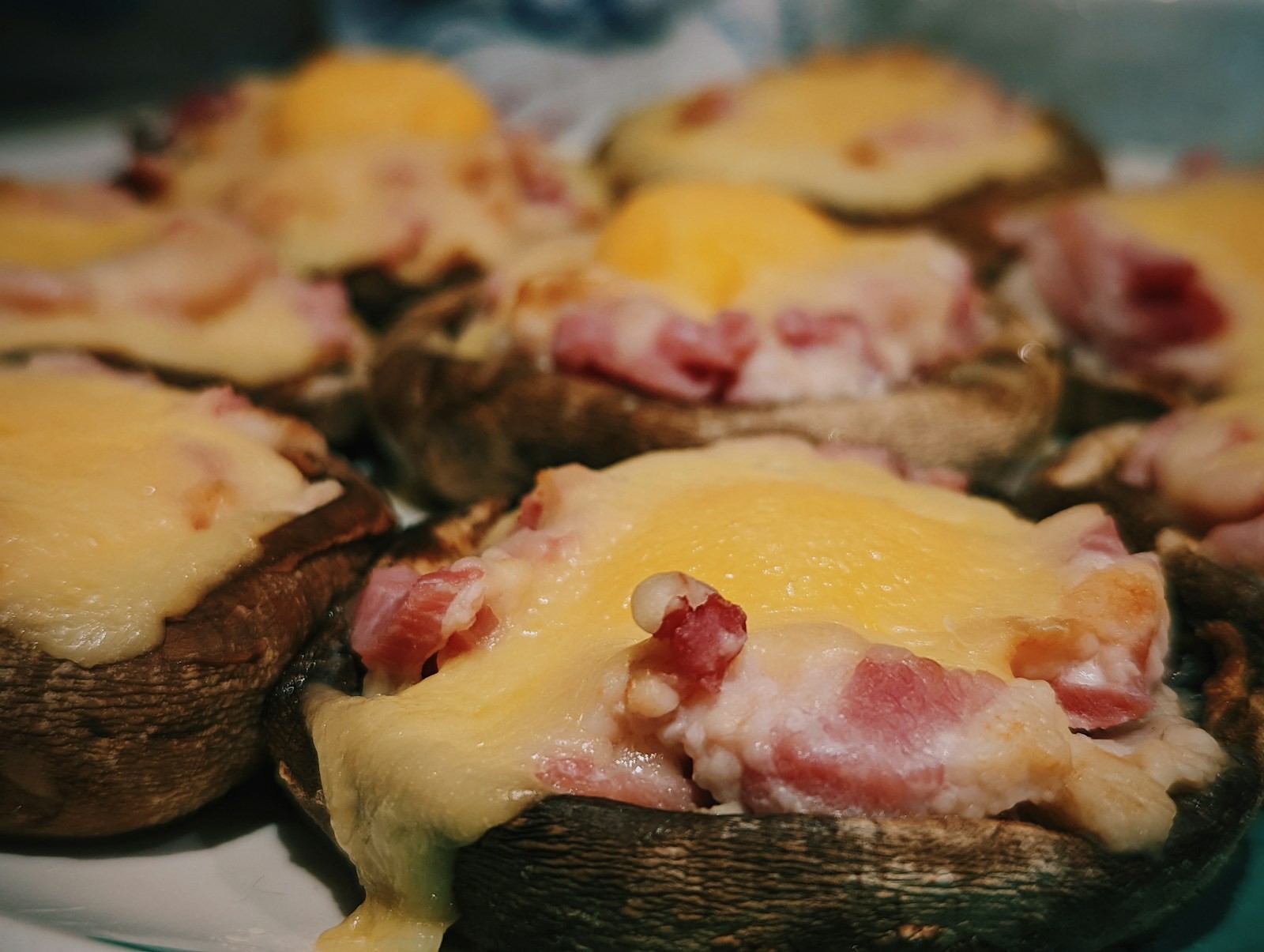 Large mushroom caps topped with melted cheese and diced ham