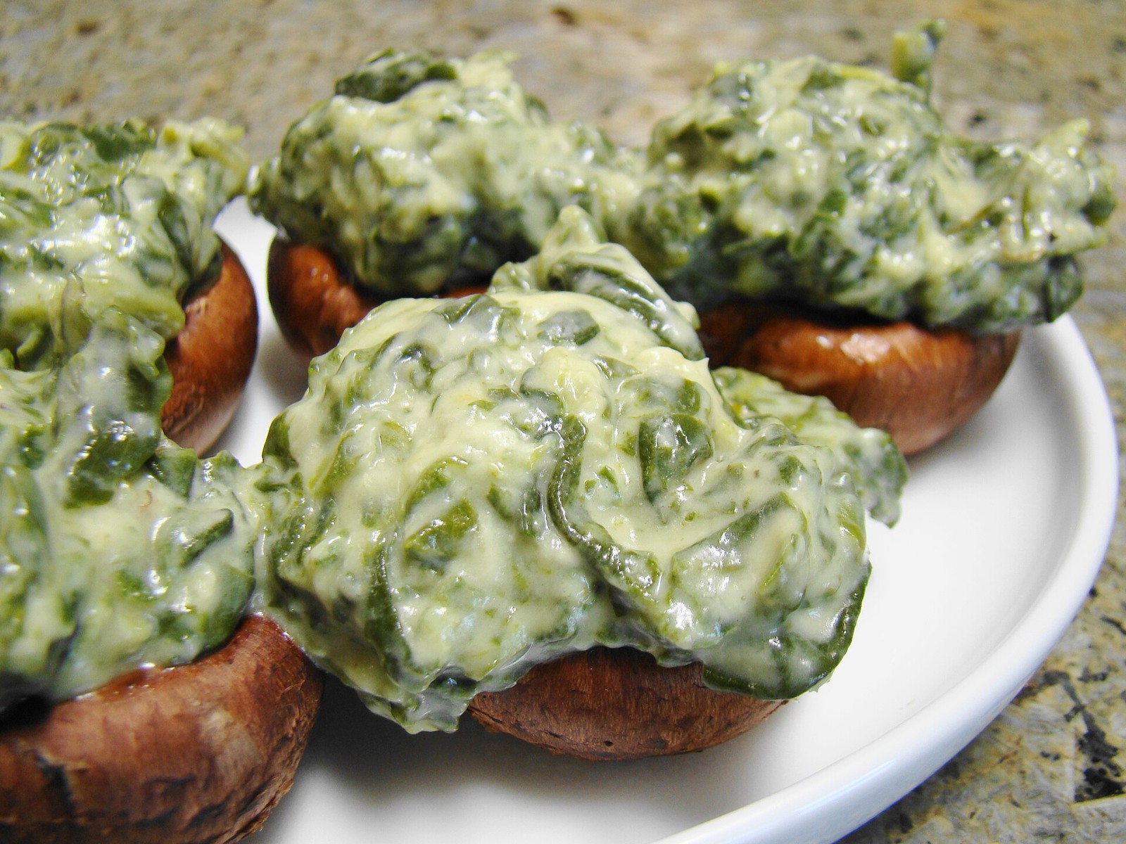 Creamy spinach filling piled on cremini caps